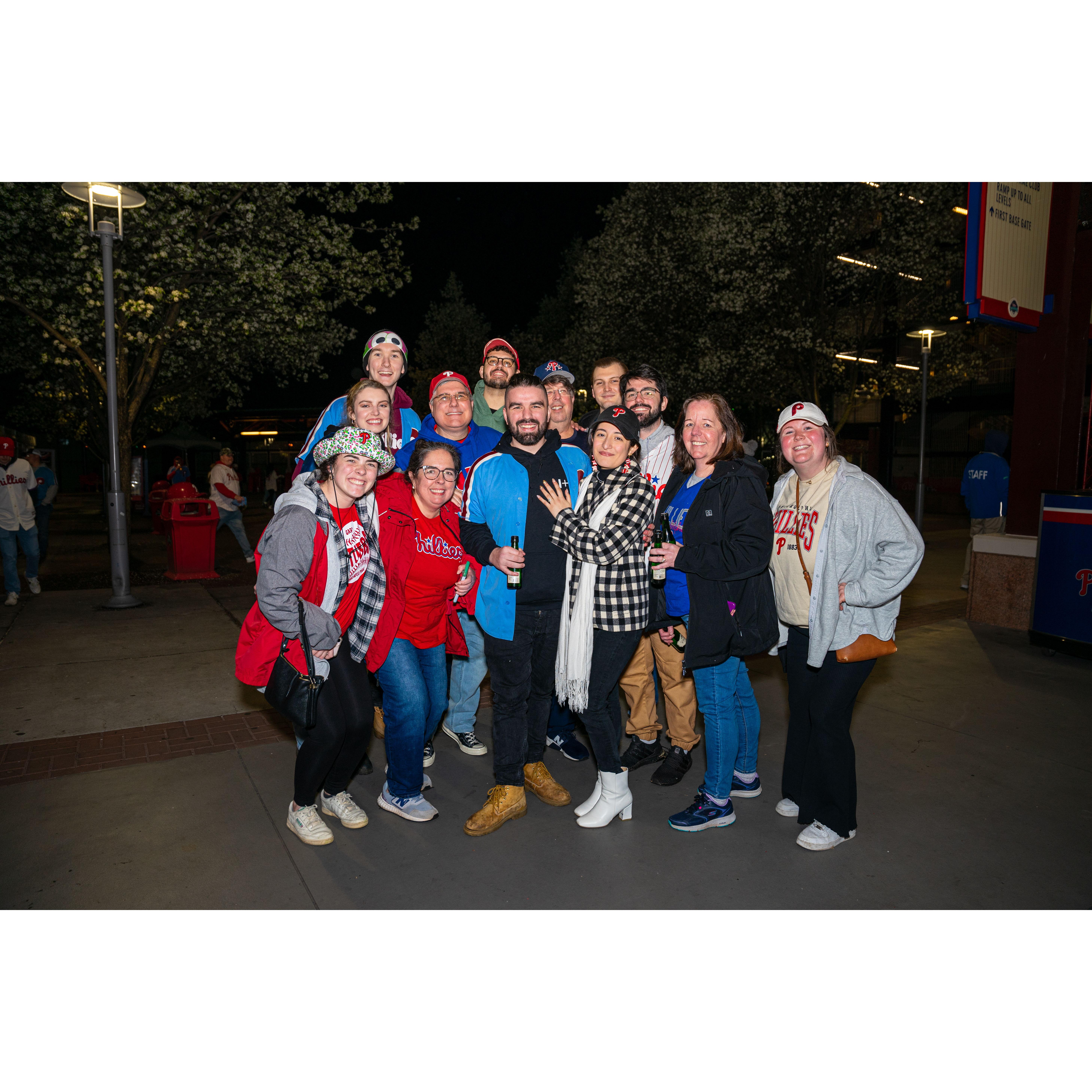 A group photo in front of section 114 where Jonathan proposed to Yolany just moments before.
