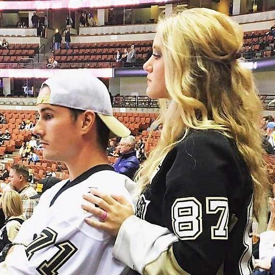 Eagerly watching the Penguins warm up, waiting for the start of the game