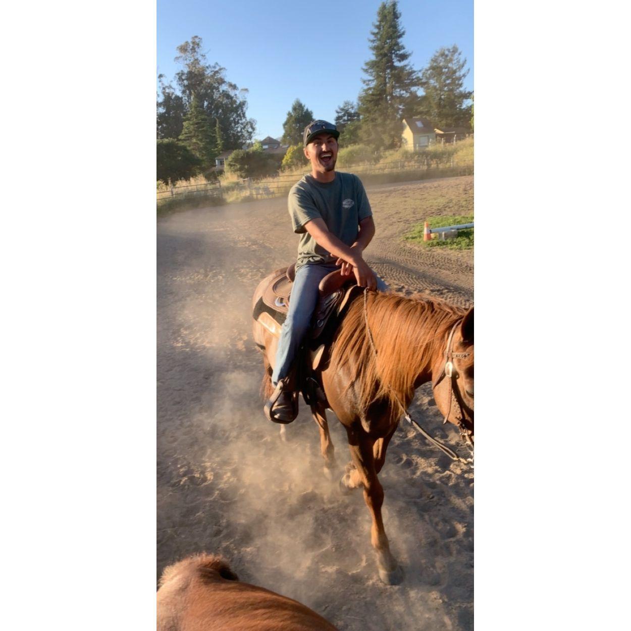 Learning how to become a Cowboy. Should have never let him ride or start roping, now it is a constant fight to whether we need another barrel horse or head horse.