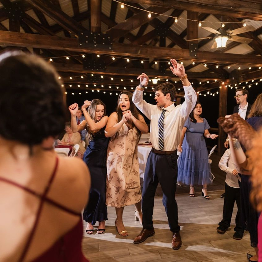 Ashley, Rebekah, and Ethan dancing the night away at their friends, Jordyn and Cam's wedding