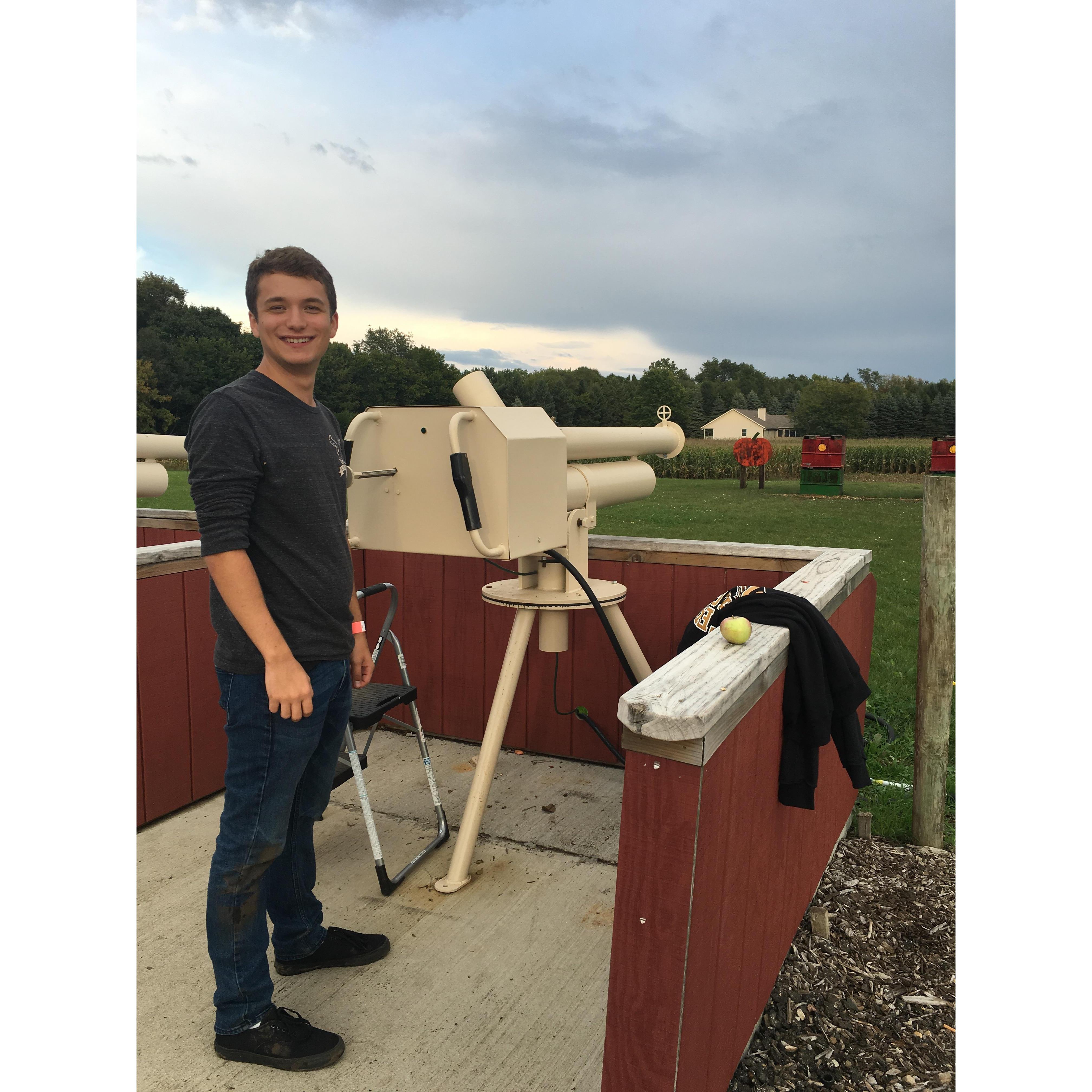 shooting apples out of an apple cannon at a farm in Michigan!