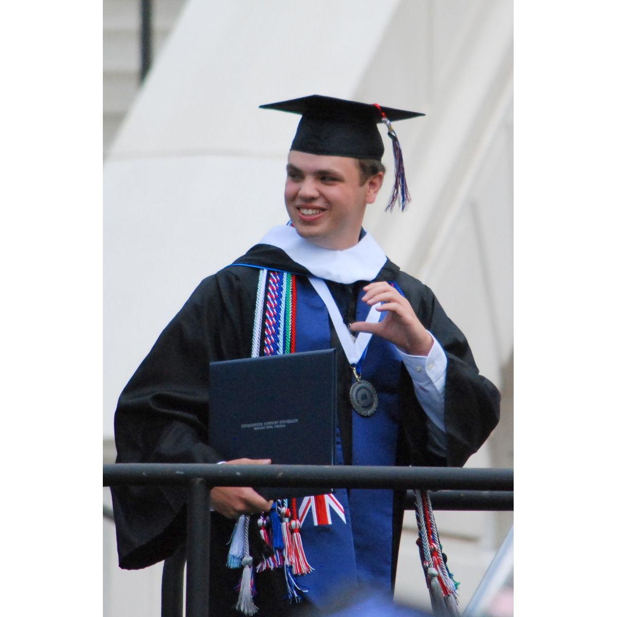 Heart hands during graduation in 2019. 