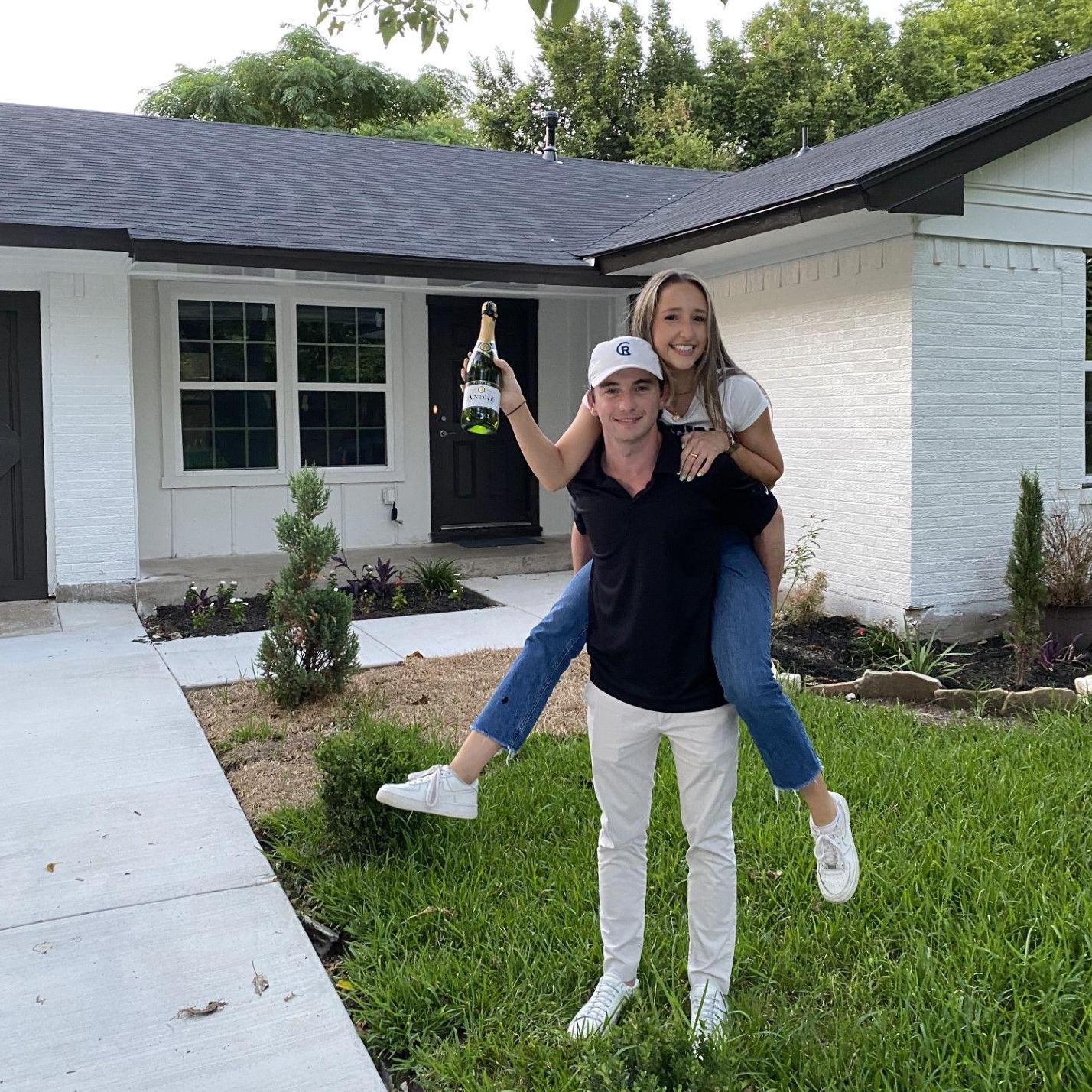 Joe and Sarah's first picture in front of their house together July 2021