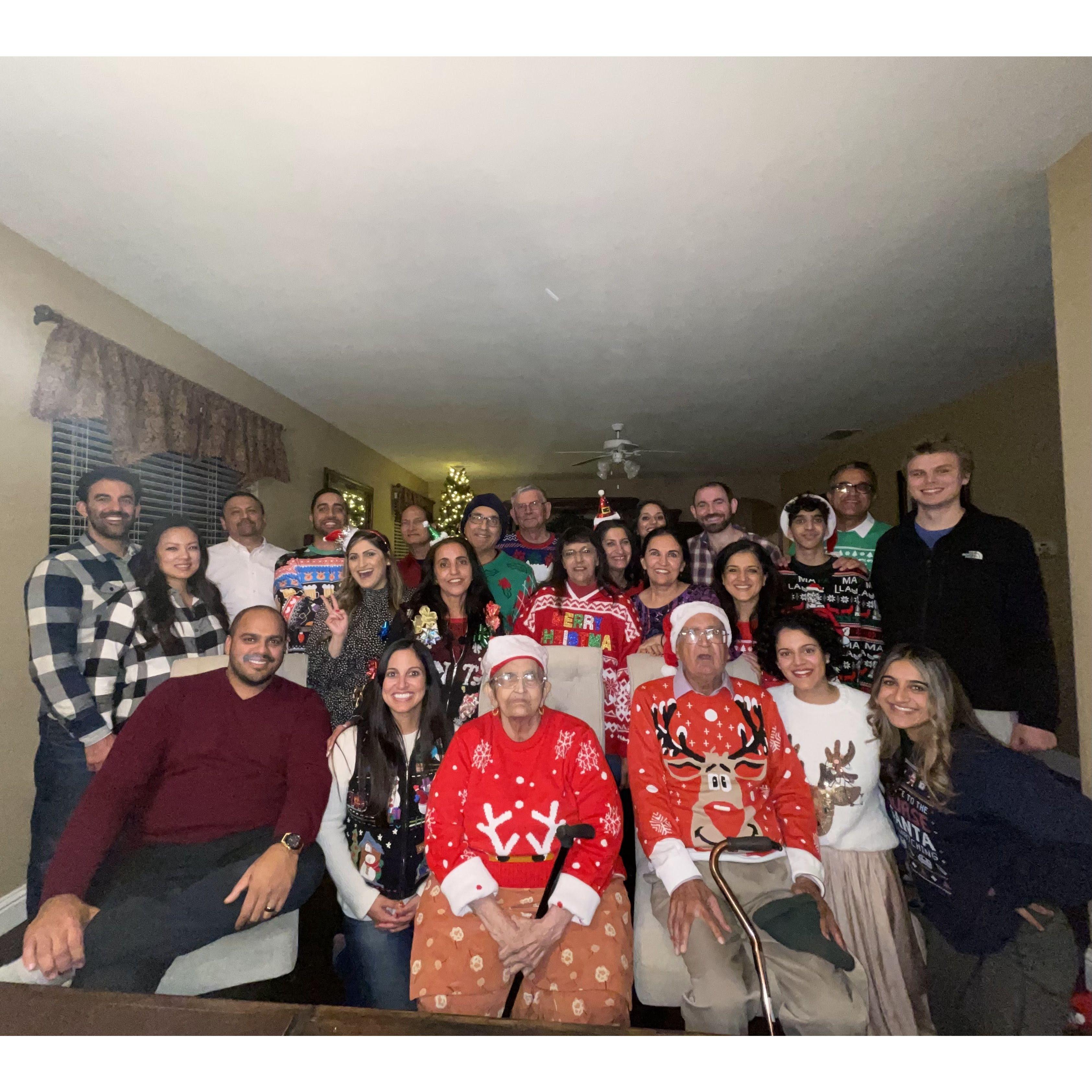 Members of Kiran's paternal family, including maternal aunts Mandy, Baljit, and Chandi (three in middle) and uncles Dr. Singh, Mike, and big Mike (three in front of Christmas tree).