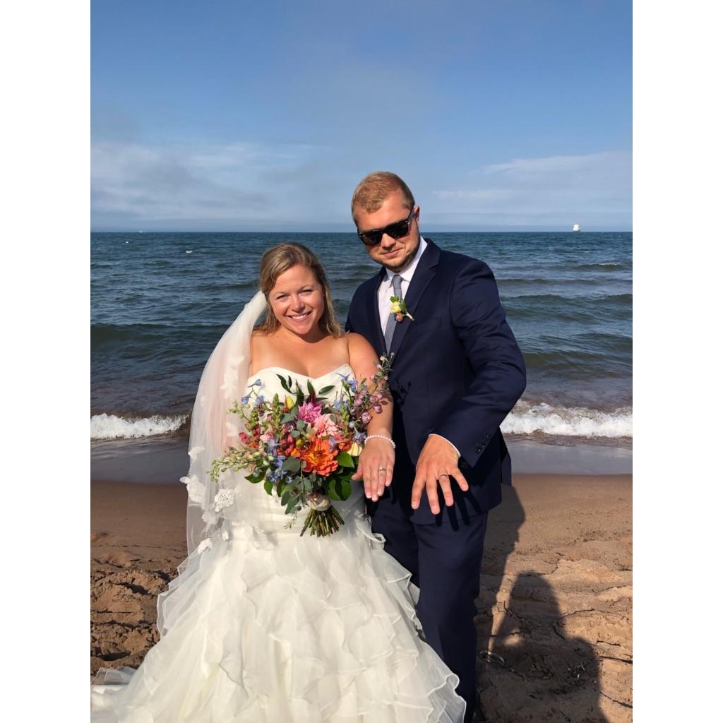 This was right after we said our vows on Park Point. The rain cleared just in time!