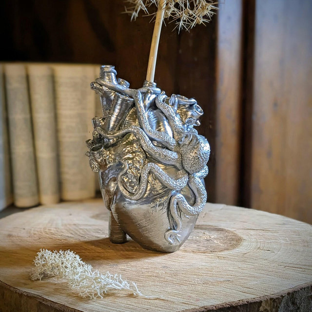 Vase my heart my love silver chrome in the shape of a human heart entwined with an octopus. pirate, Cthulhu, heart, vase, cabinet of curiosities