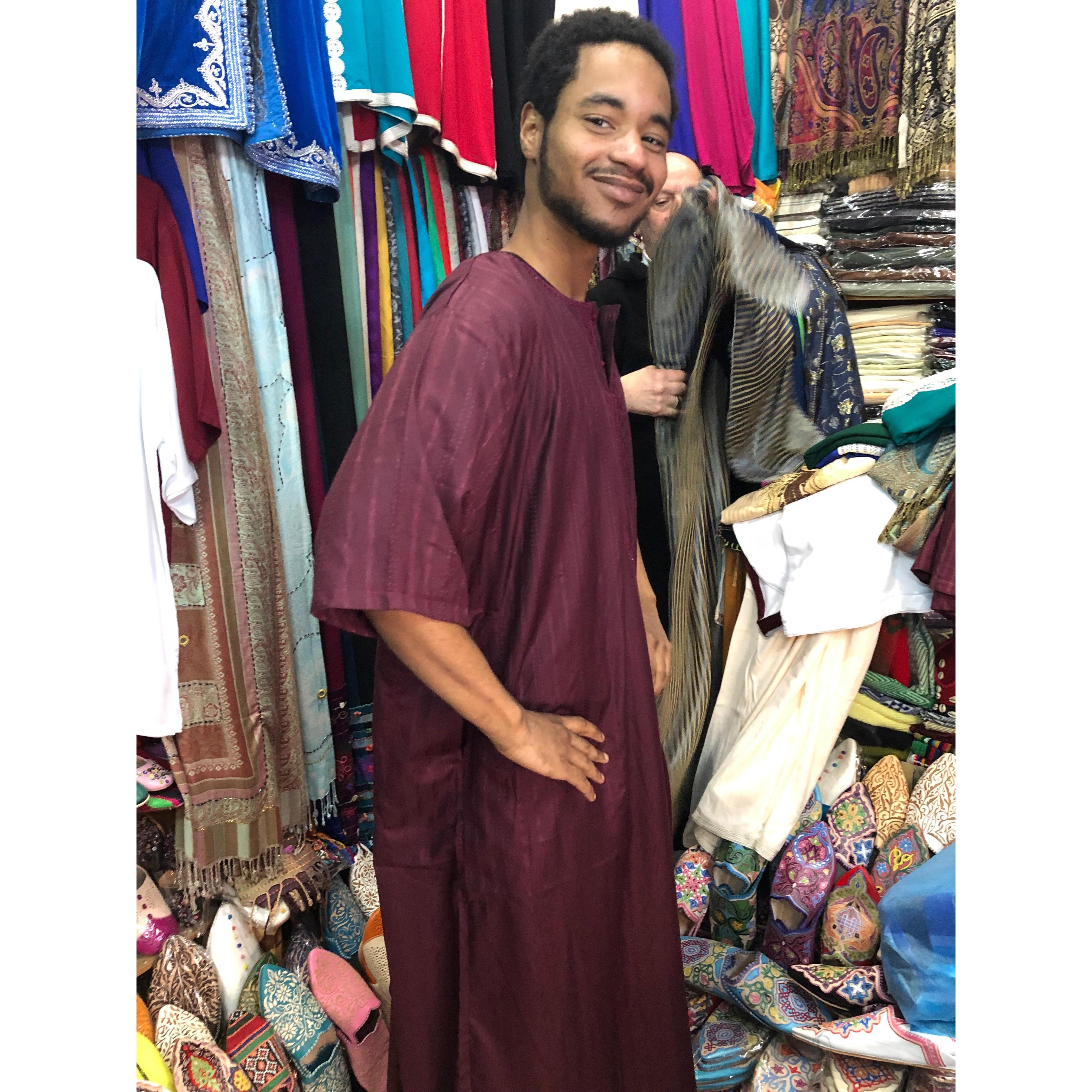 Rico trying on Moroccan clothing.