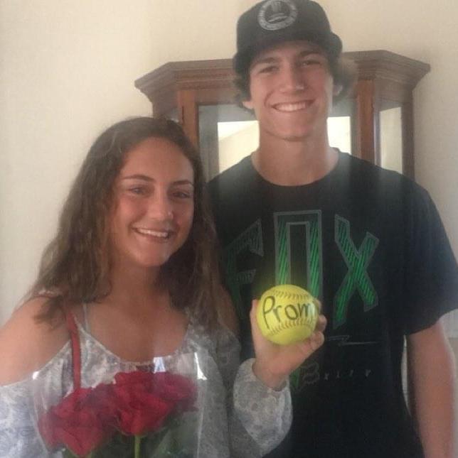 Mathew said he asked his brother Daniel for a softball and when his family asked why? He said, "I am going to ask Izzy to prom" and walked out the front door.