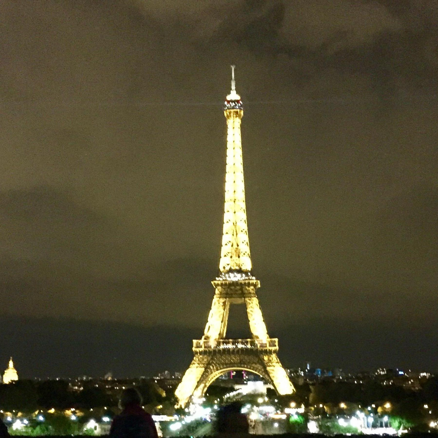 Walking away from the Eiffel Tower where we got engaged at the top 30 minutes earlier.
