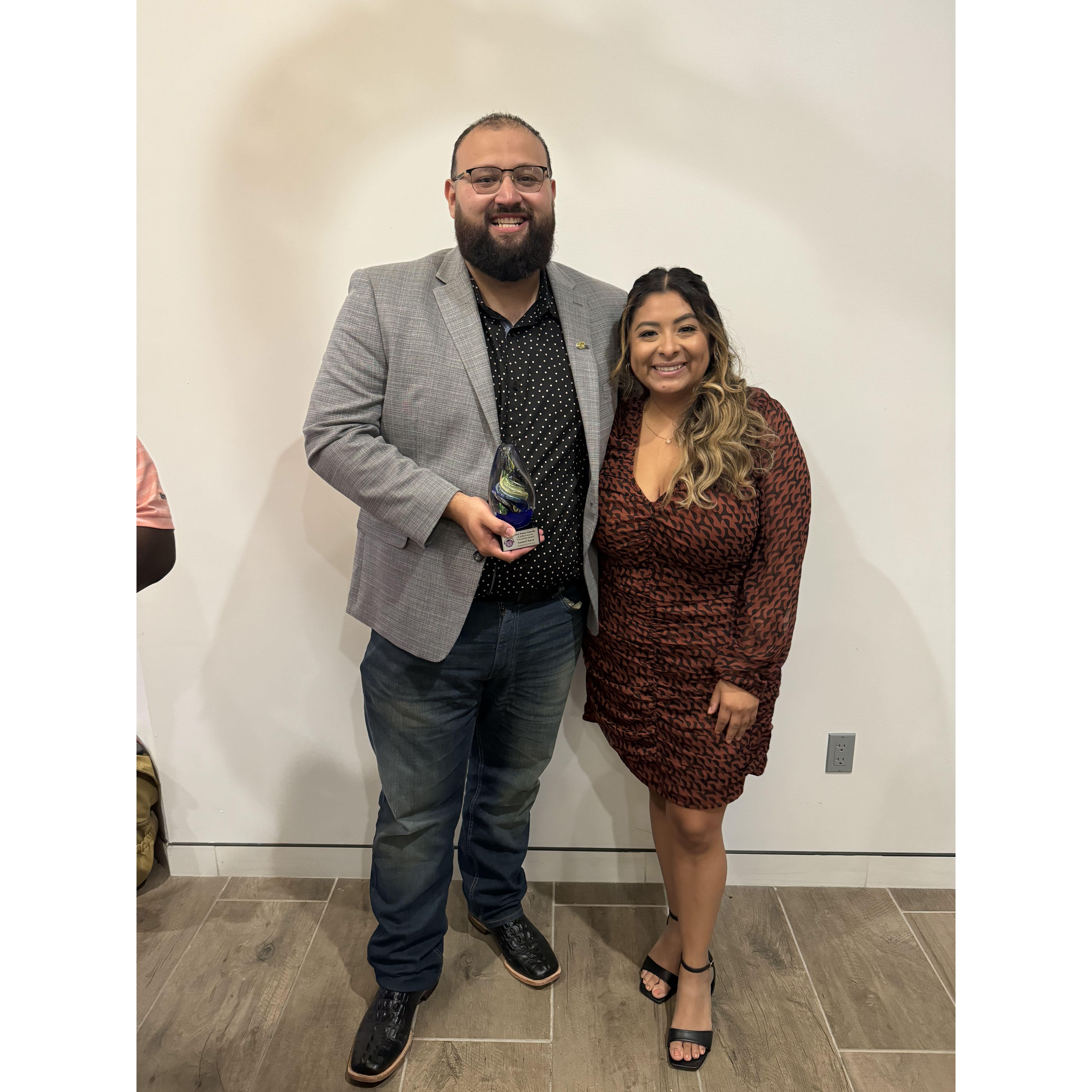 Sam receiving, "A Difference In Education' award. 2024.