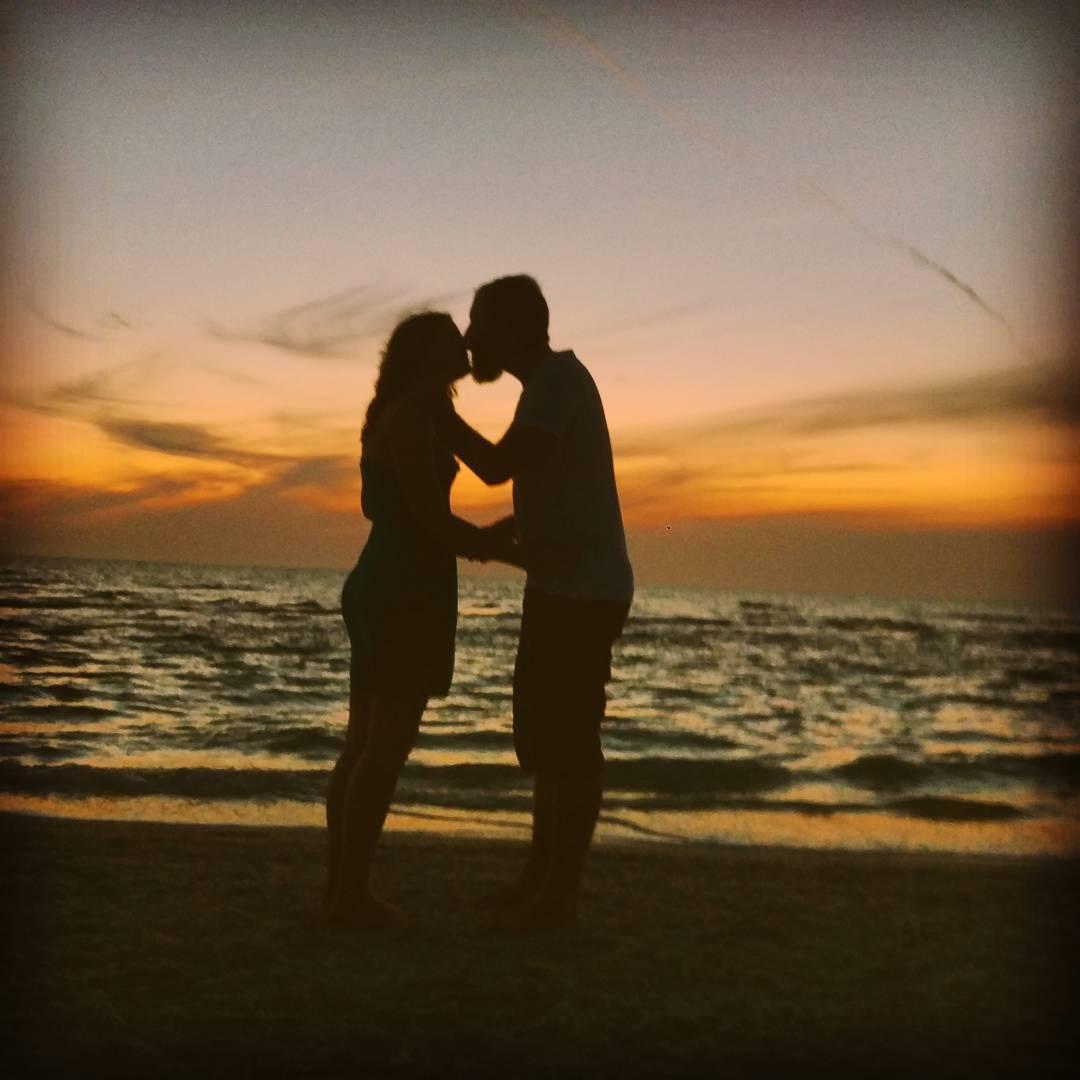 Sunset kisses during our senior year spring break.