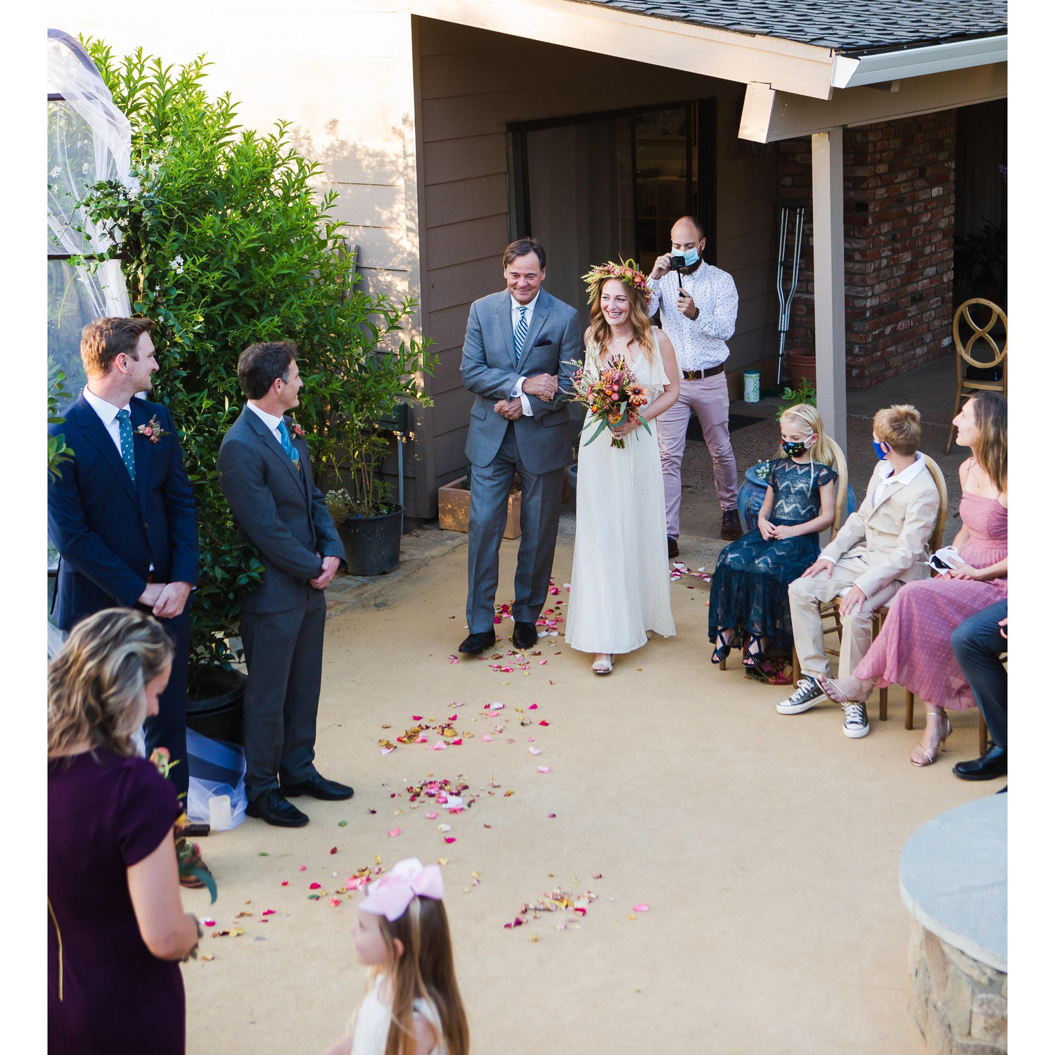 Lizzie's dad, Bob, walking her down the aisle