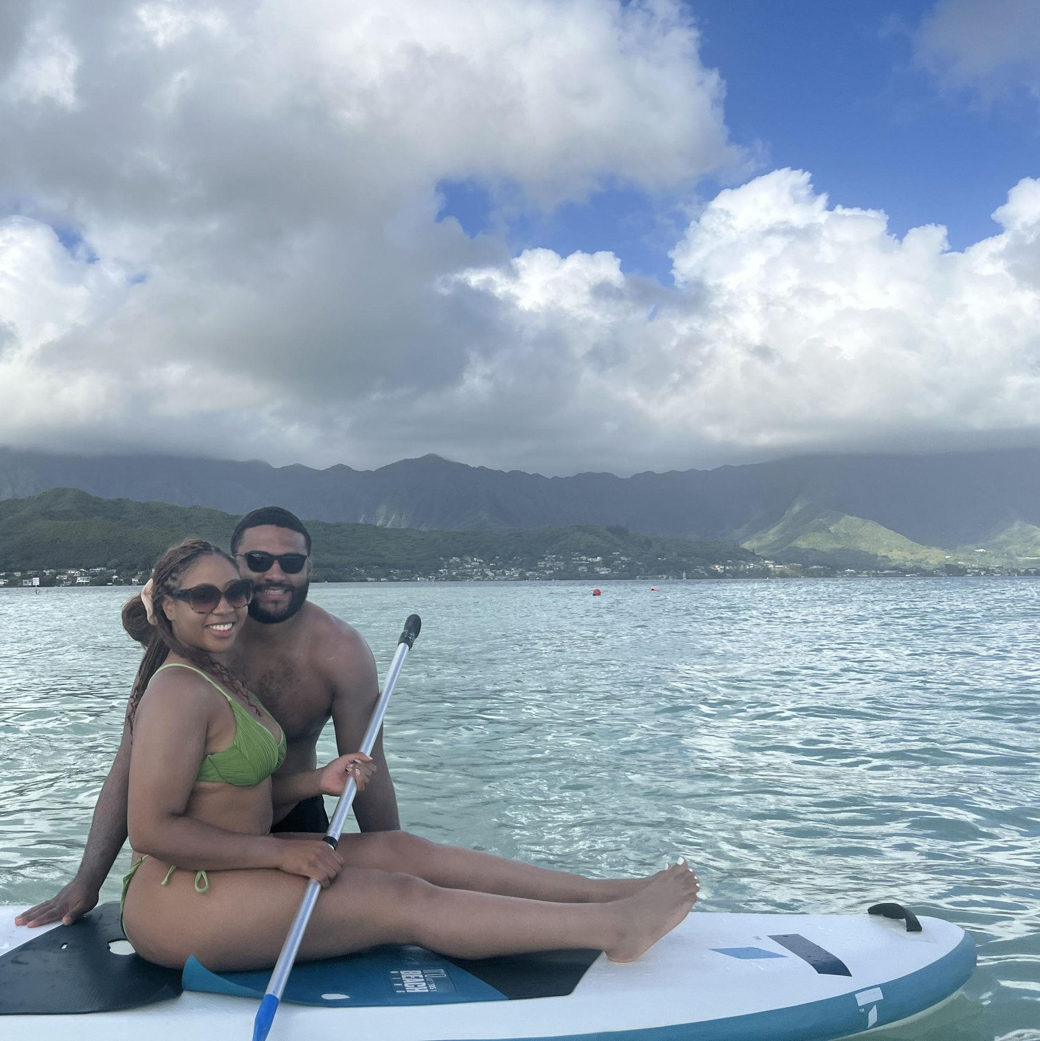 We love to travel, and this is us on a sandbar in Hawaii :)
