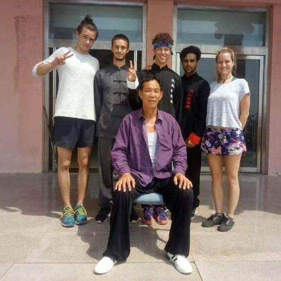Us and our Shifu at the Kung Fu academy in China, where we met.
