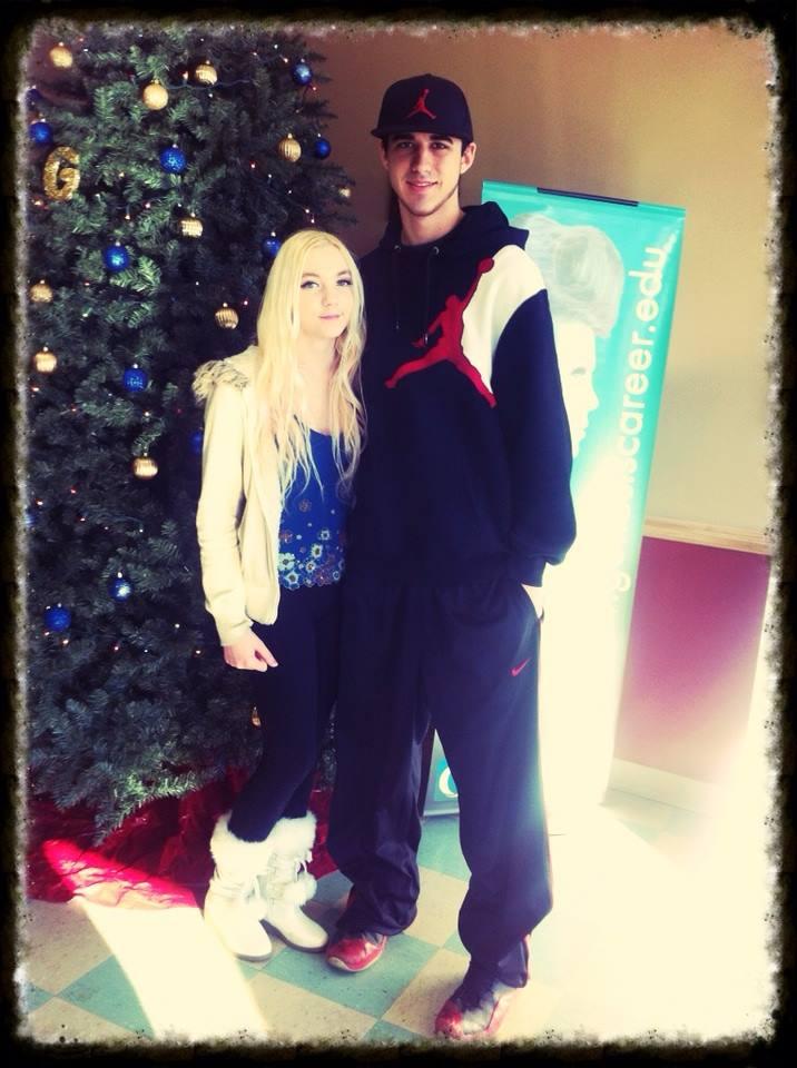 this is the first picture of us together. we were going on our 2nd date and mom asked to take a picture of us by the tree in her school. it was really awkward but so adorable now.