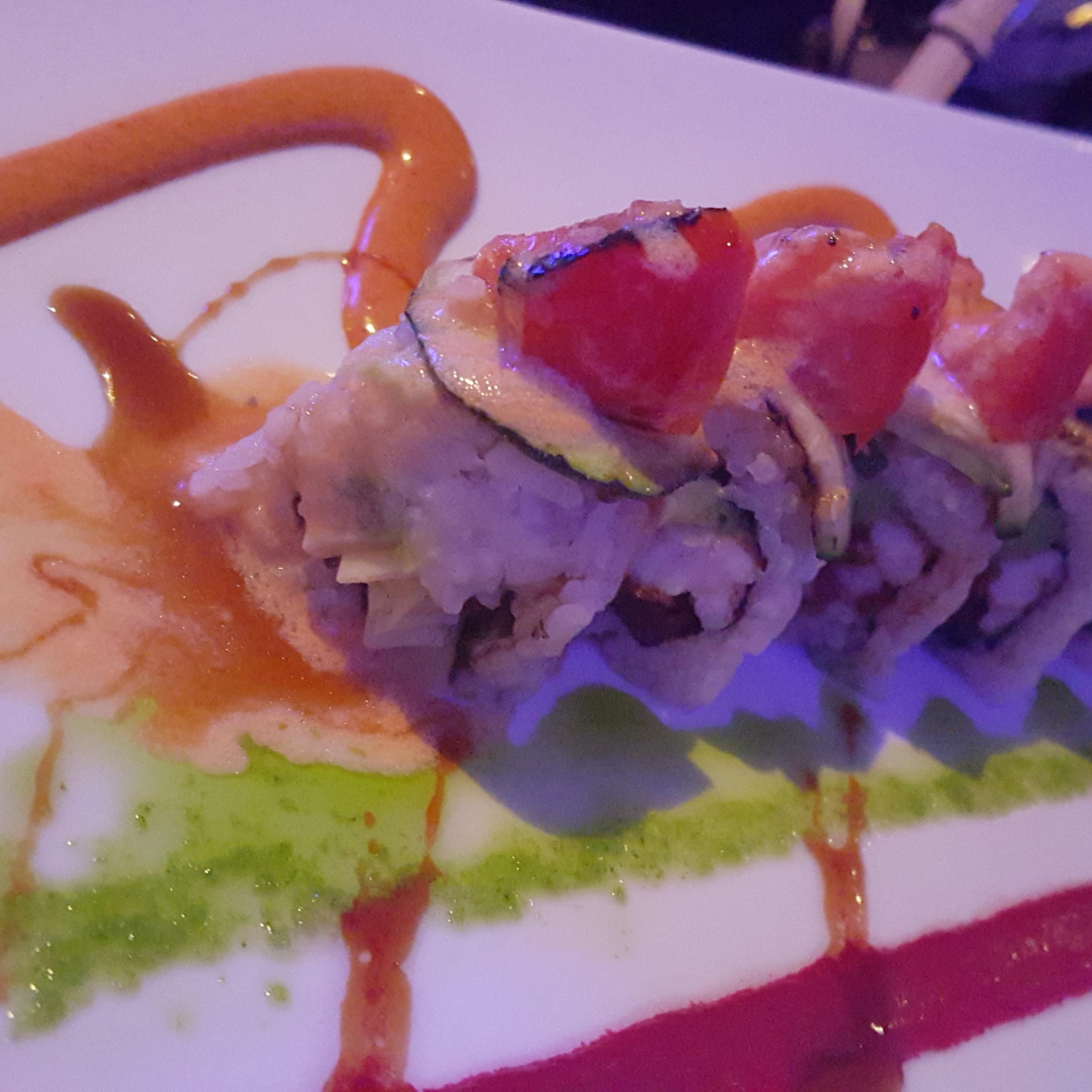 This is a picture Ray took during their first date at Sakana Sushi. Melissa used her phone to help with lighting.