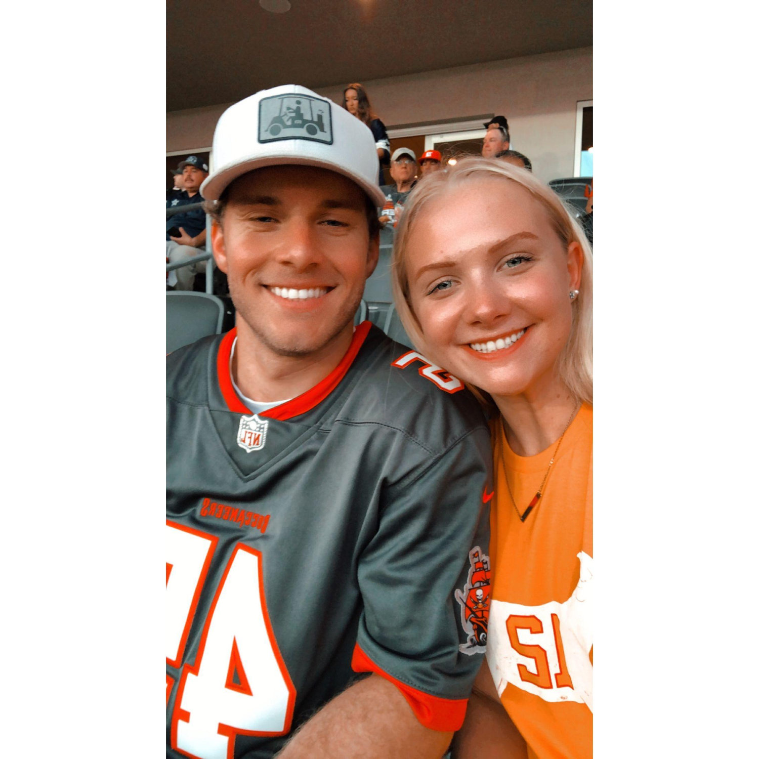 Brandon and Torey LOVE football! This was taken during a Tampa Bay Buccaneer game! Torey grew up a lover of the Patriots and seeing TB12 during this game was a dream come true! September 2021