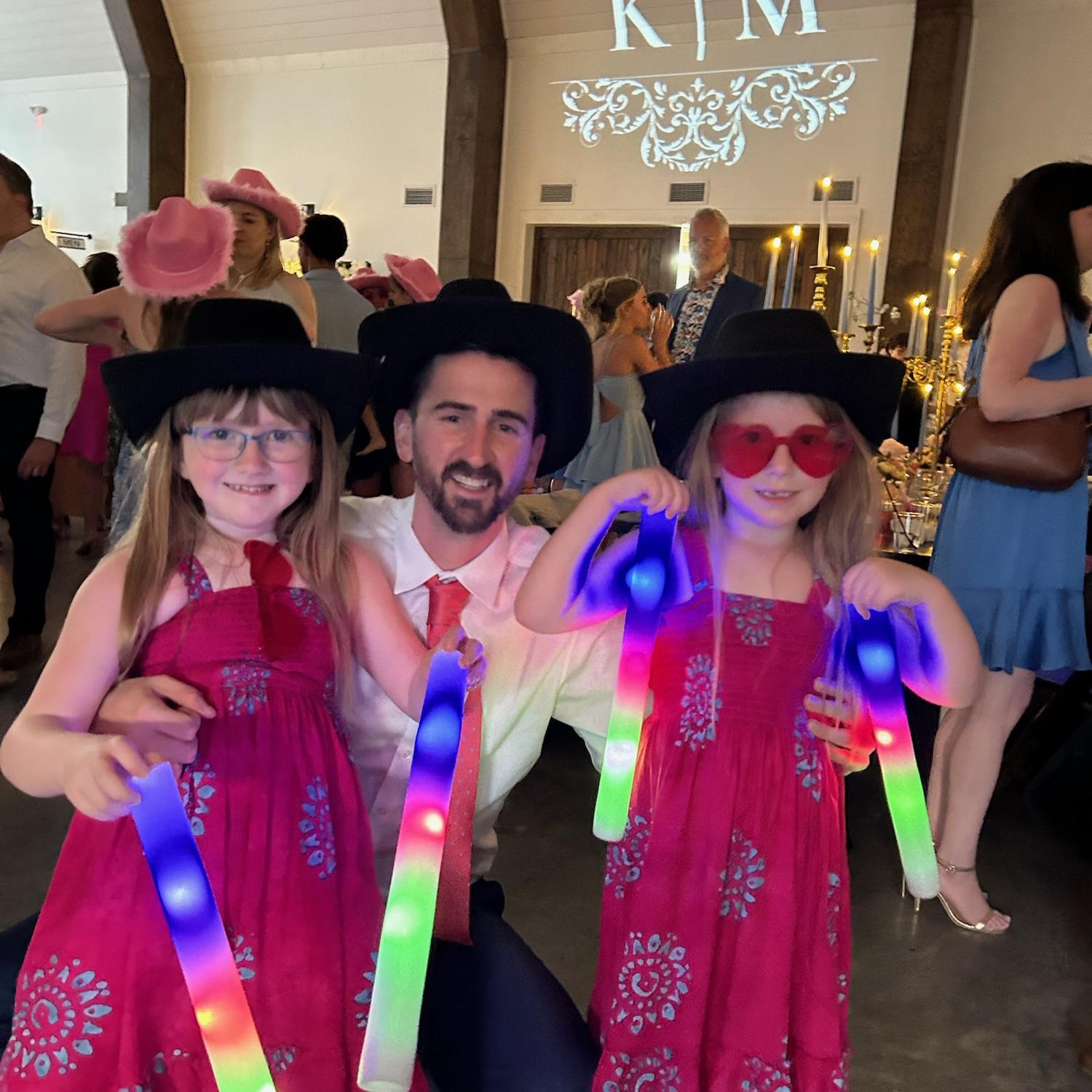 Andy, with his nieces at a family wedding in Kansas City.