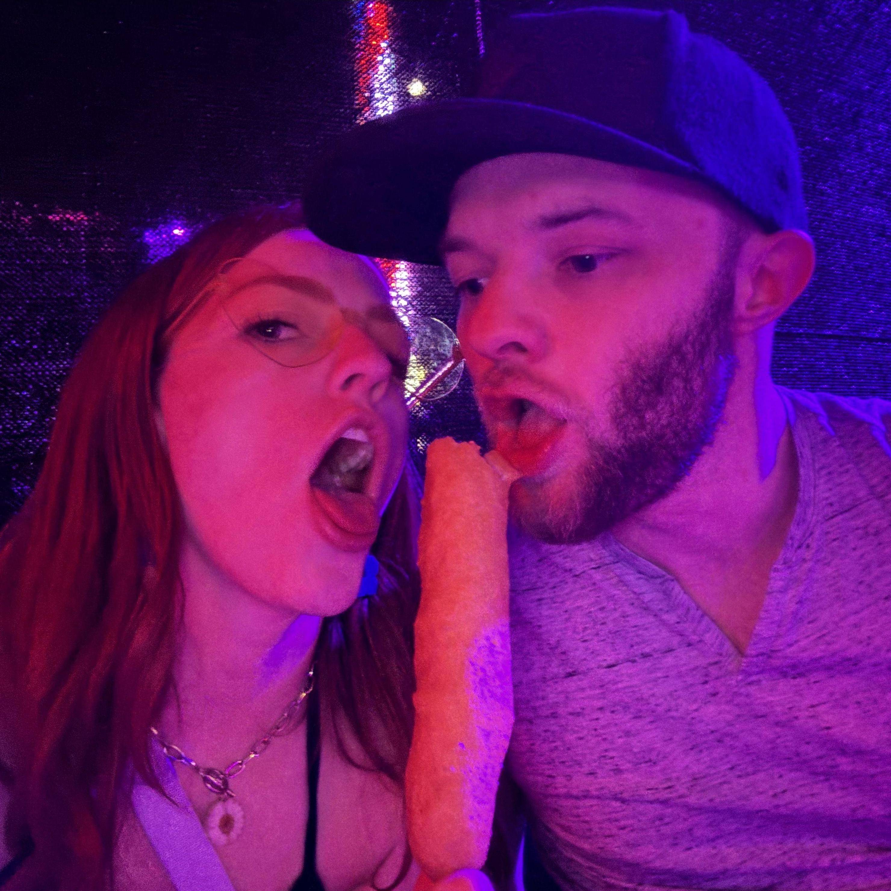 sharing a corn dog at EDC.