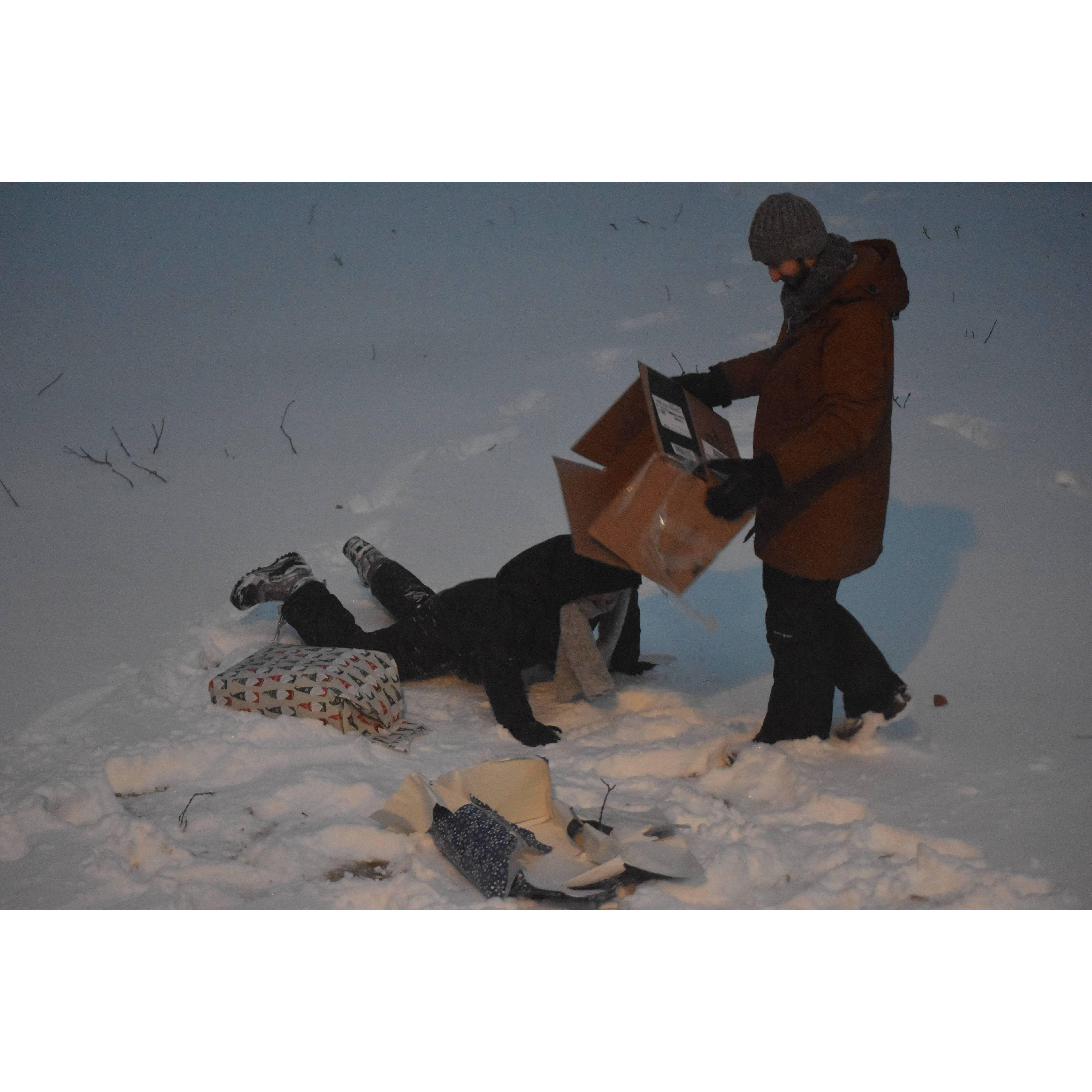 Engagement in December 2022, opening a homemade scrapbook in a blizzard