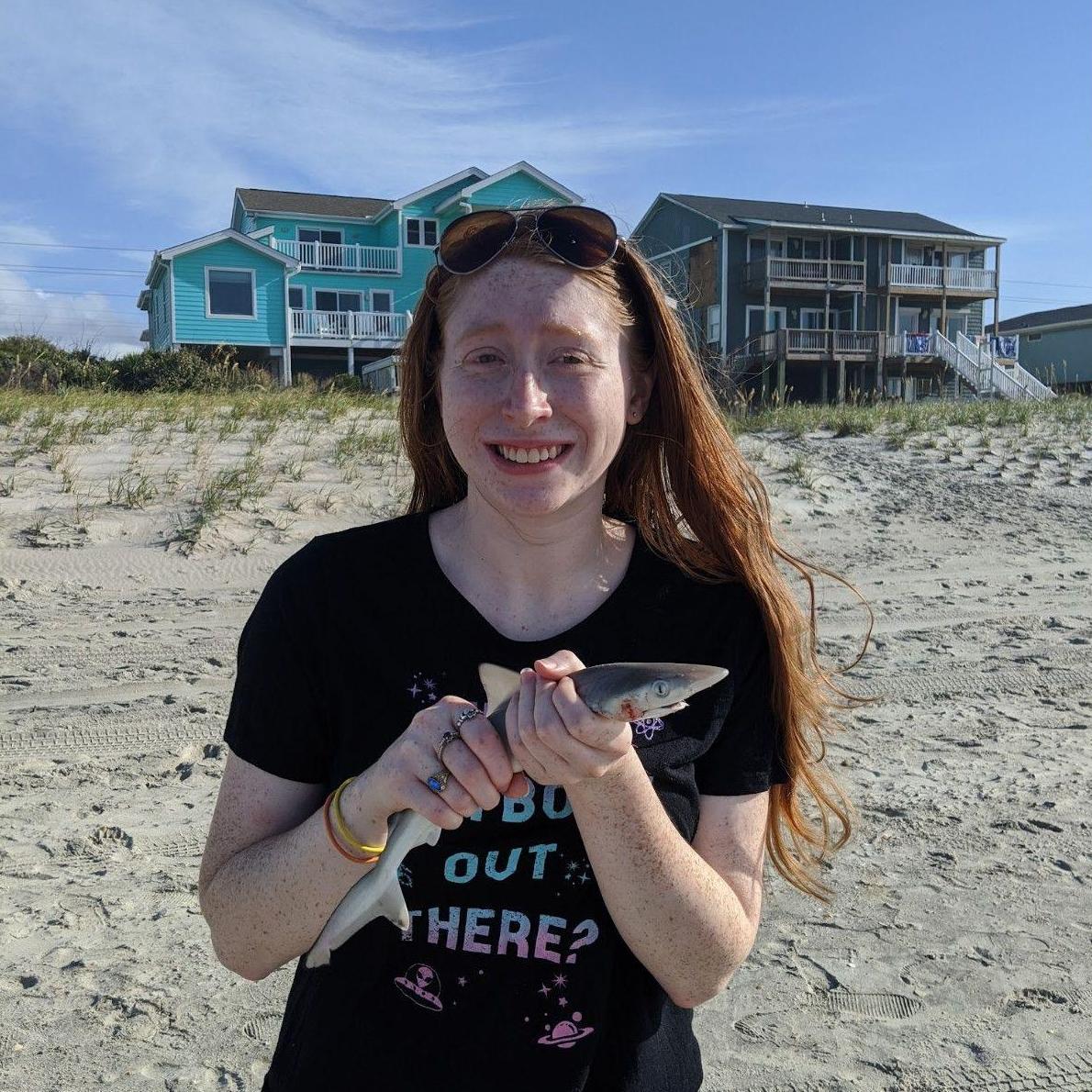 Kat was happy fishing! She was not thrilled to catch a shark.