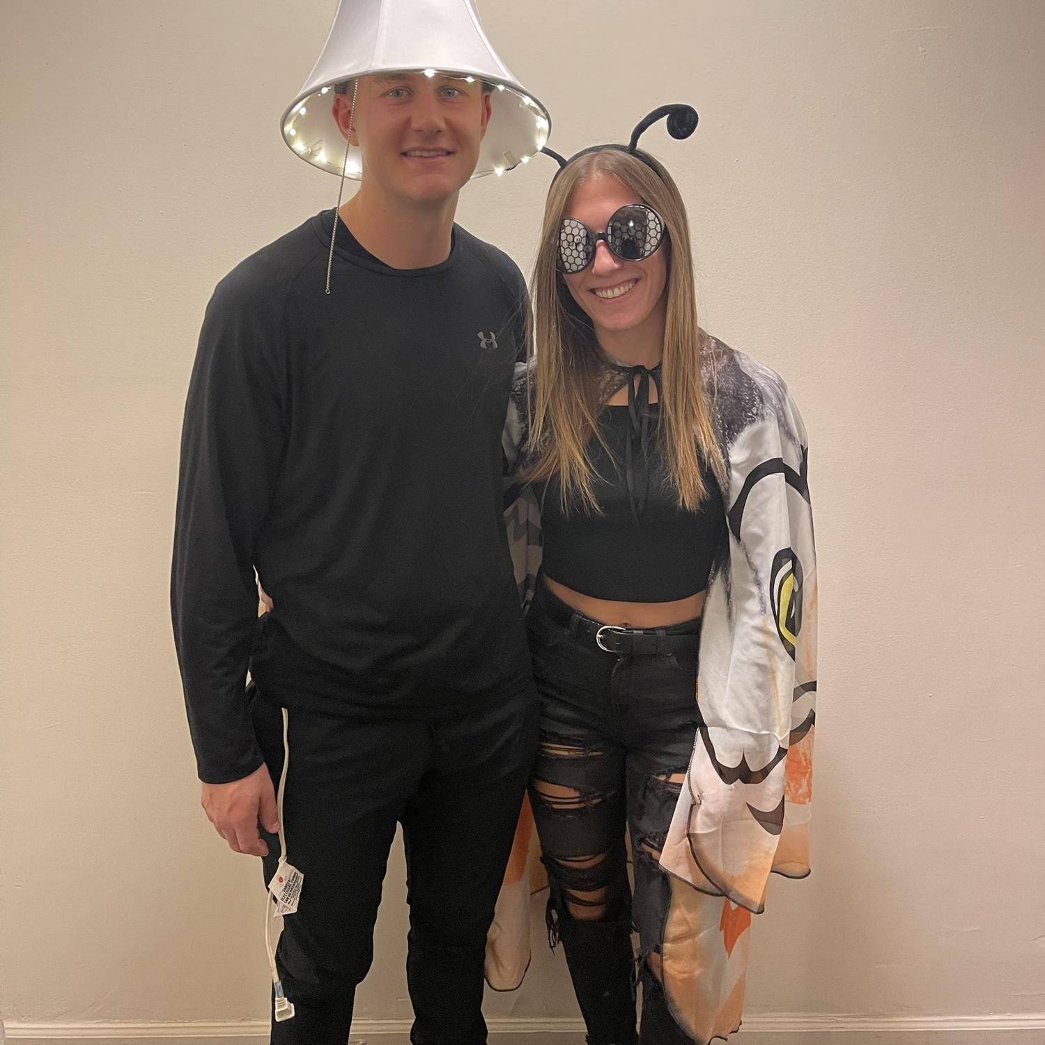 Halloween 2022 - Zach went as a lamp and Kelsey went as a moth!