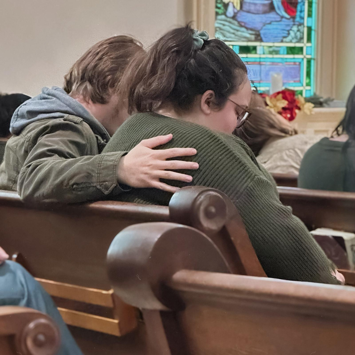 A church friend didn't know we were dating, but happened to be peeking during the prayer at church; she was shocked to see this! It was the first time Josh put his arm around Carrianna at church, too.