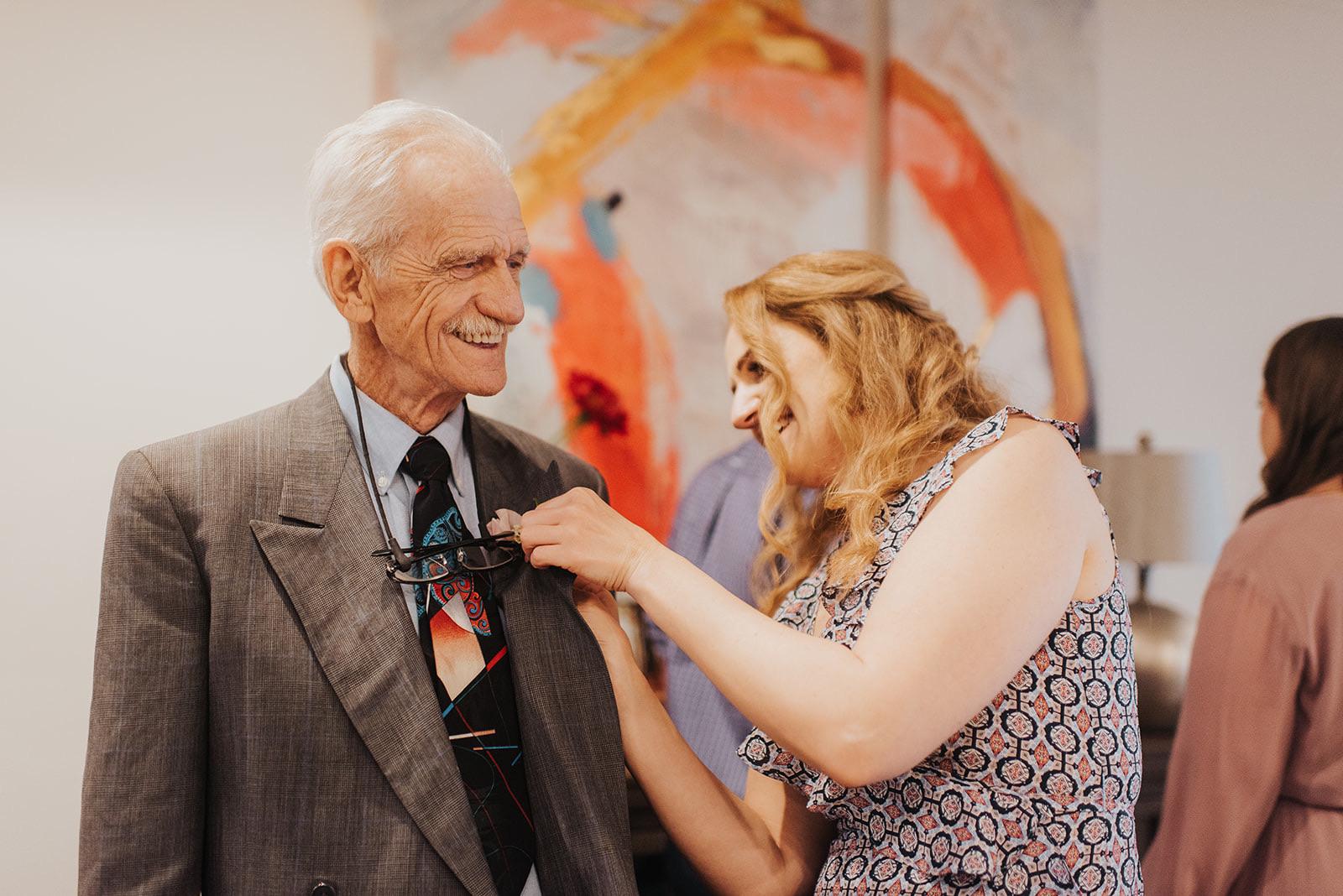 The father of the groom, KW, happily getting his boutonnière