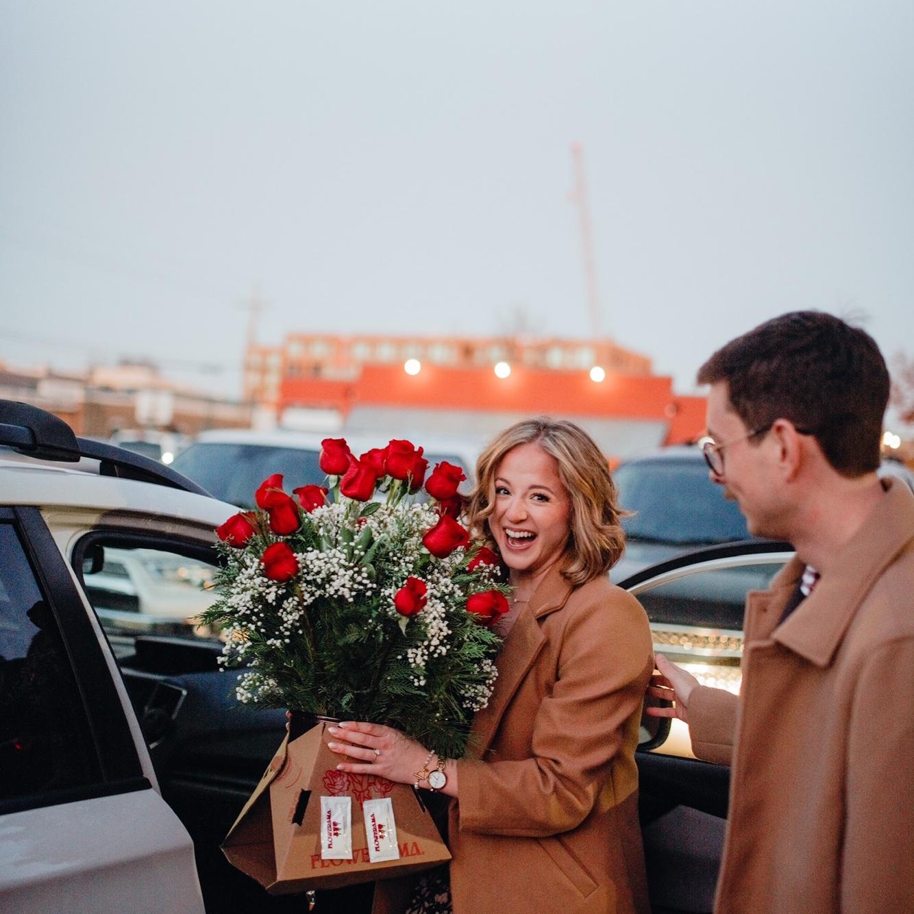 Chris surprising me with an even bigger version of the flower arrangement he got me on Valentine's day.