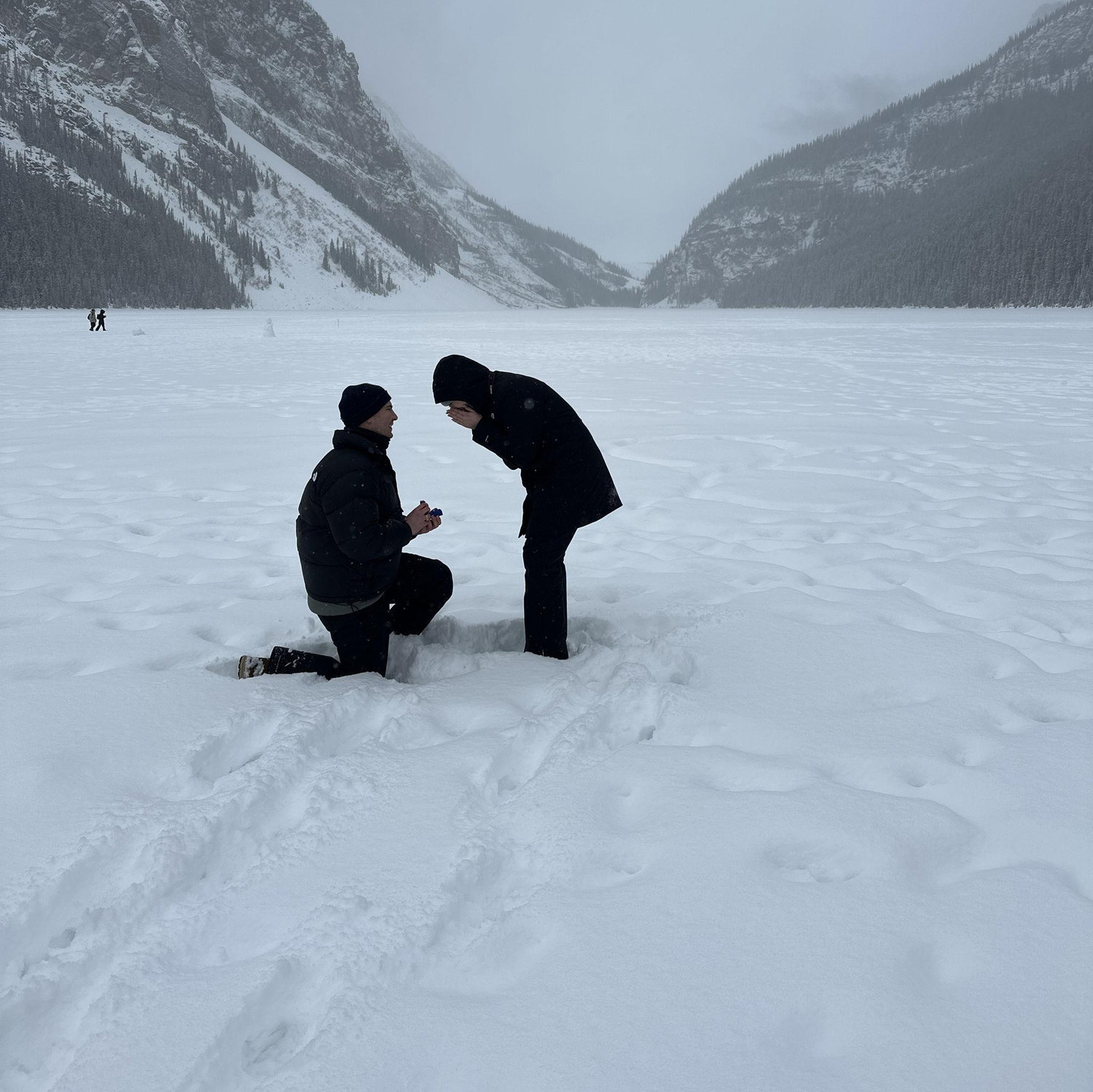 Allison said "Yes!" in the middle of frozen Lake Louise in Banff, Canada. Brian disguised the trip as his '30th birthday trip' ;)