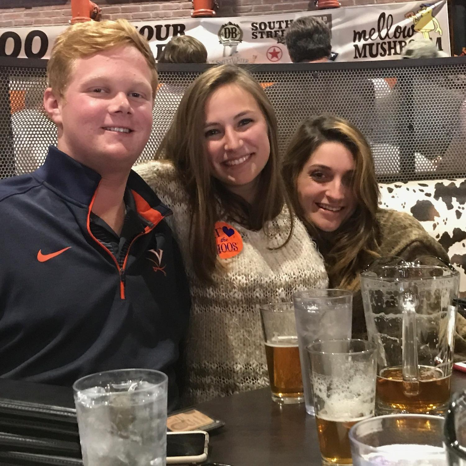 Our first picture together (with our matchmaker) at the UVA/VT game in 2016