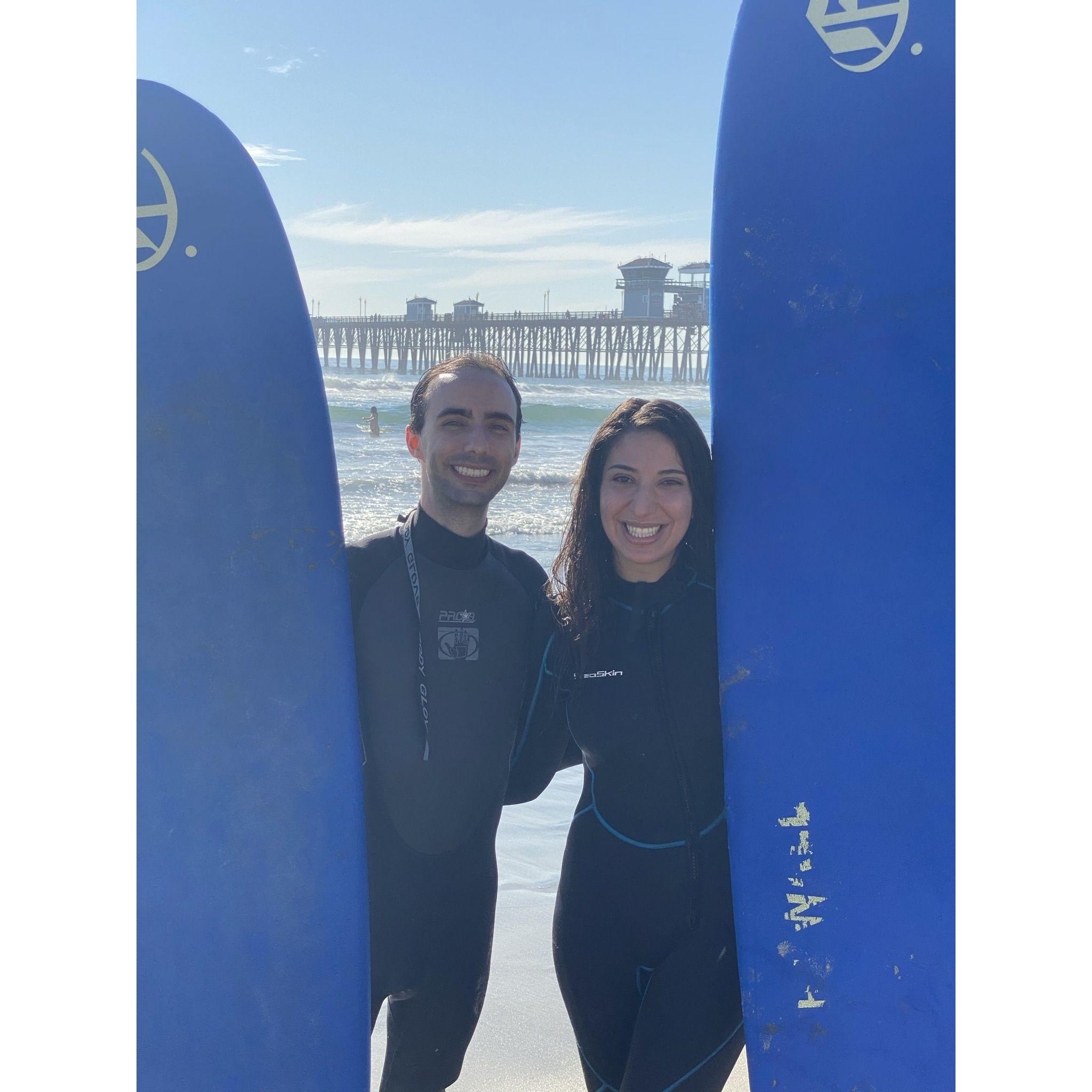 Rob teaching Gaianeh how to surf in Oceanside, CA
