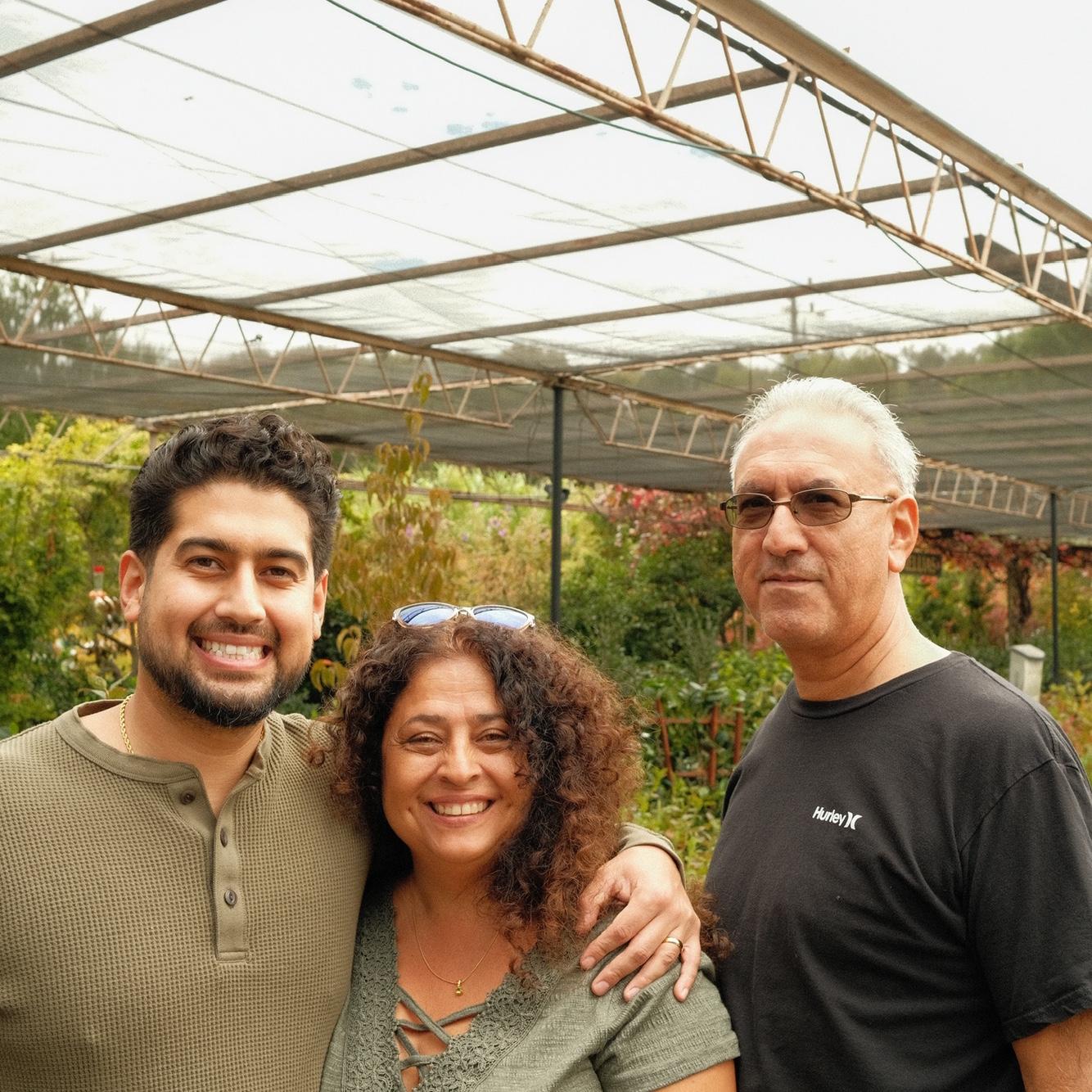 Travis & his parents. 

Donna was in on the proposal plan, but Jim was just as shocked as Travis was!