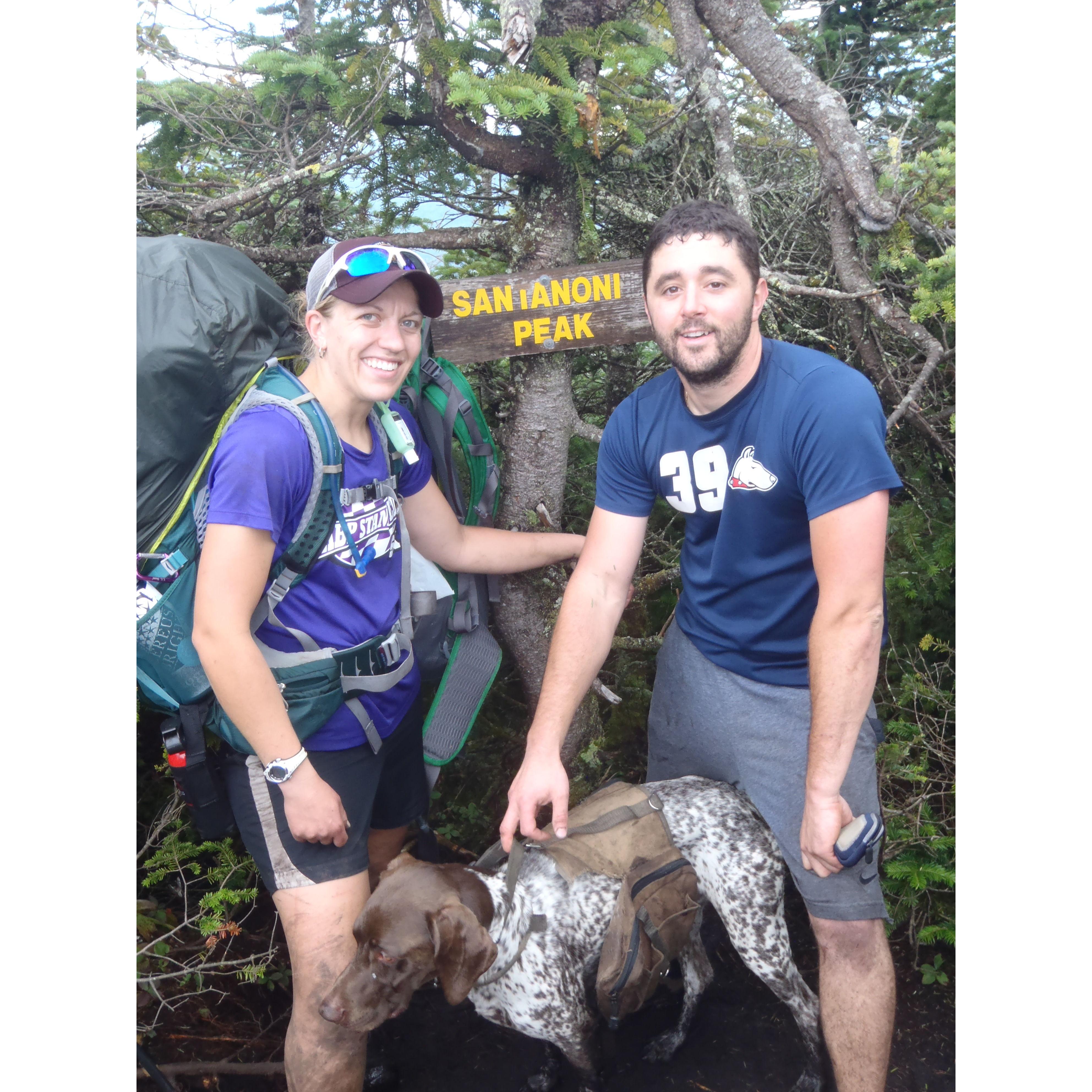 Our 3rd high peak, and last of the day, Santanoni Peak. You can tell we were exhausted at this point but the mud, sweat, and bear spray were worth it. The beginning to many more hikes together.
