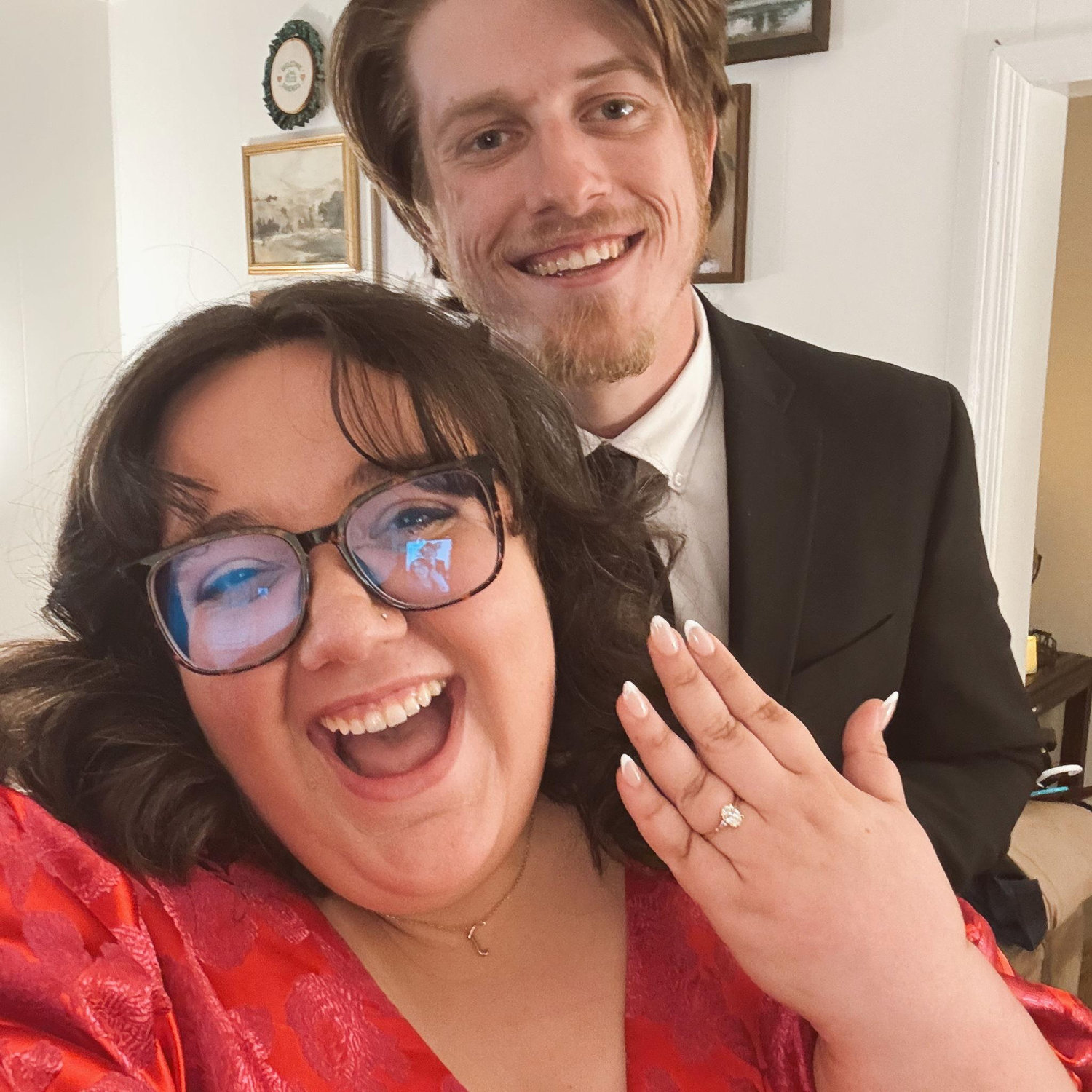 She said yes!!! Josh proposed on the front porch of the old Sauley farmhouse—the home where we will begin our marriage. We had to snap a photo to send to our families!