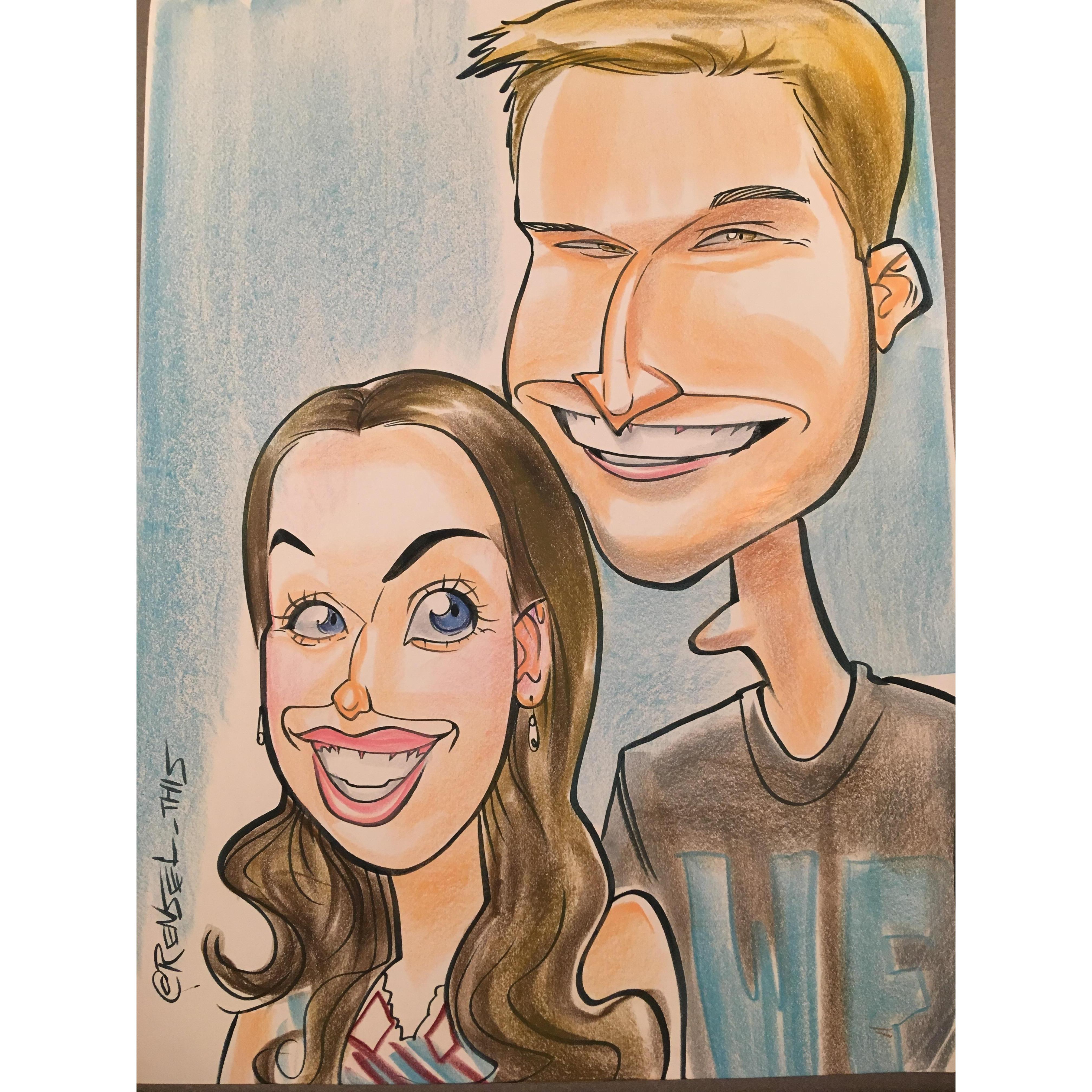 Getting our caricature done at the fair! I think that looks pretty accurate!