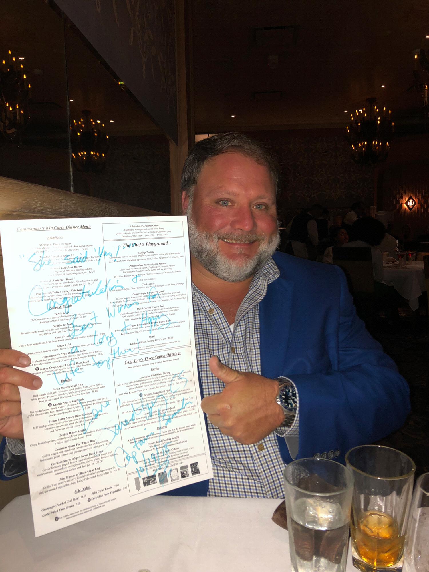 The restaurant gave the couple a menu with a congratulatory message as a keepsake.