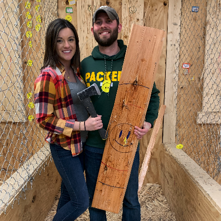 Our first photo together & both too happy to be holding an axe.