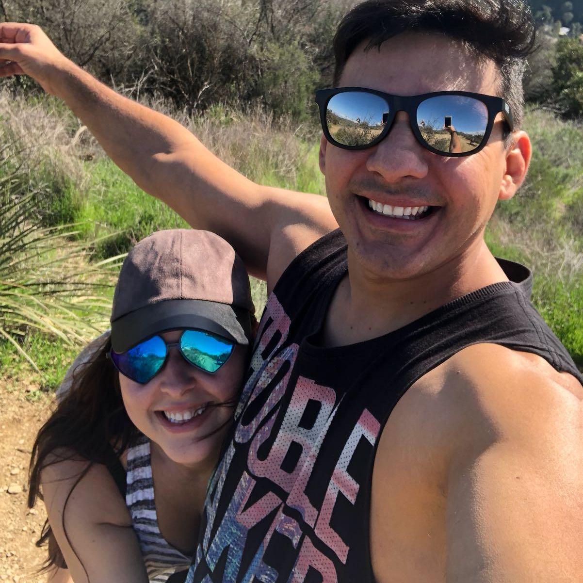 He loves to take pictures. She likes to be weird.