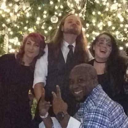 A photo with friends at a holiday party.