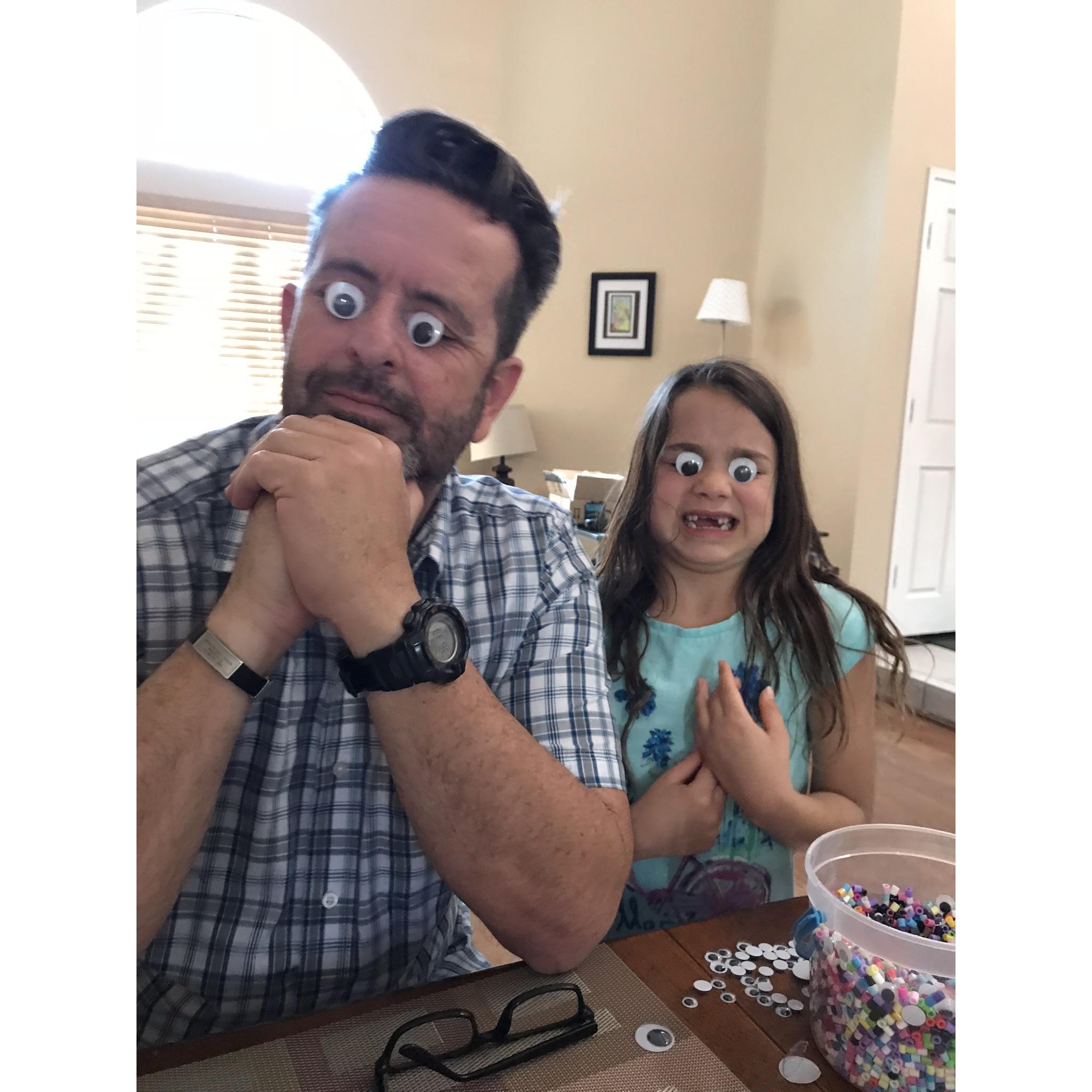 Brian and Rose being silly wearing “googly eyes.”