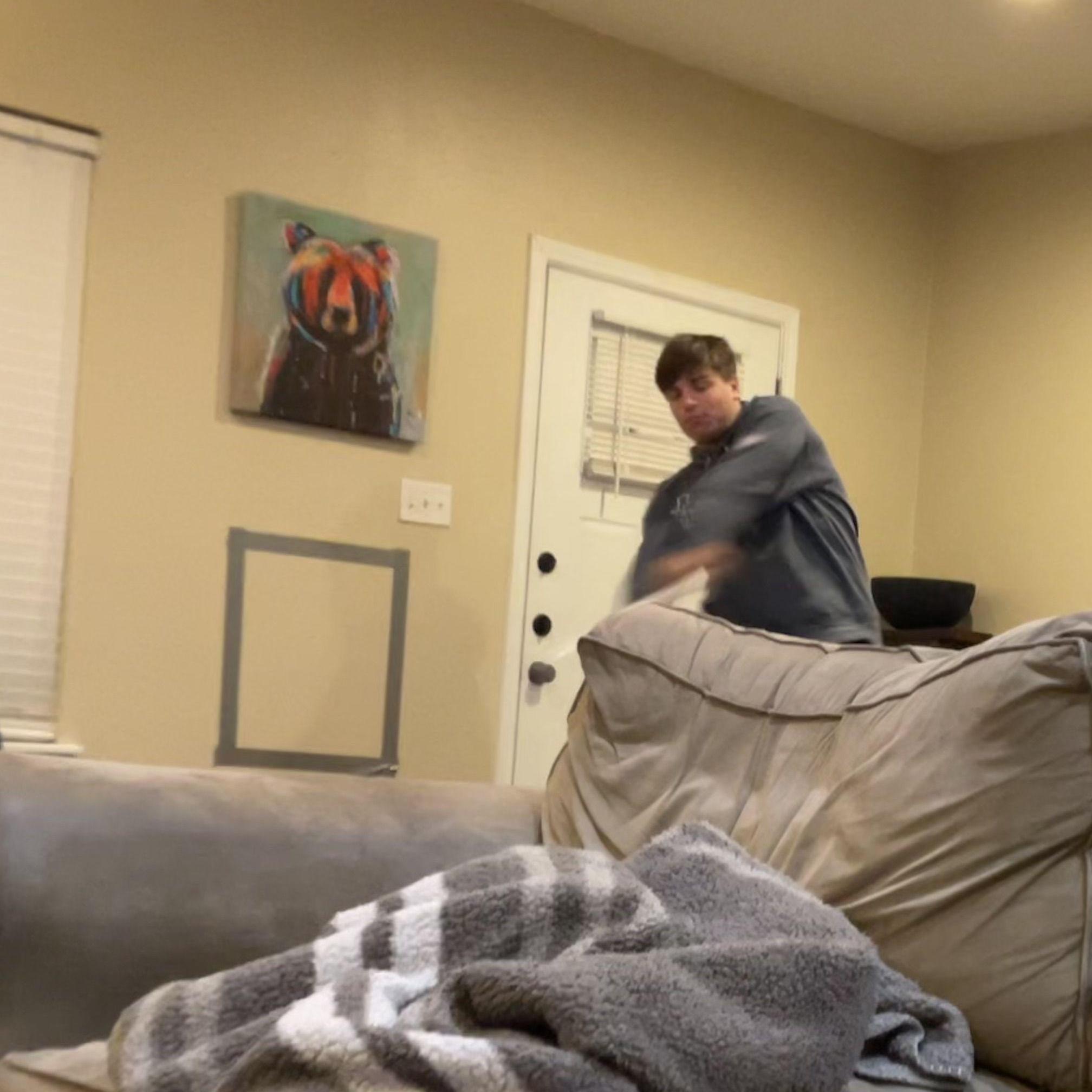 College fun. Notice the taped box on the wall? This is in-house baseball played with ping pong balls and a plastic bat. Kylee is actually pretty good at hitting despite it being a ping pong ball.