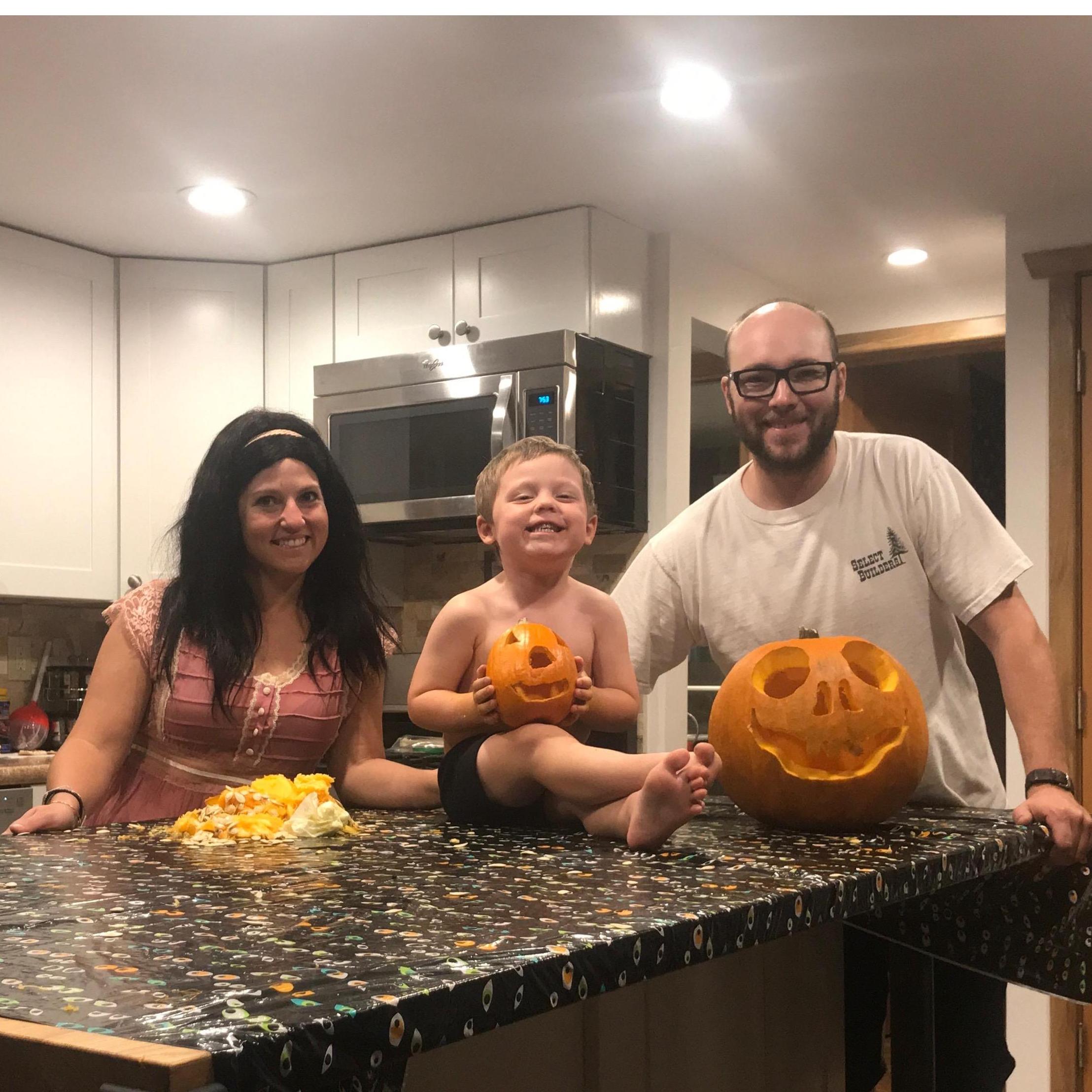 Family night carving pumpkins