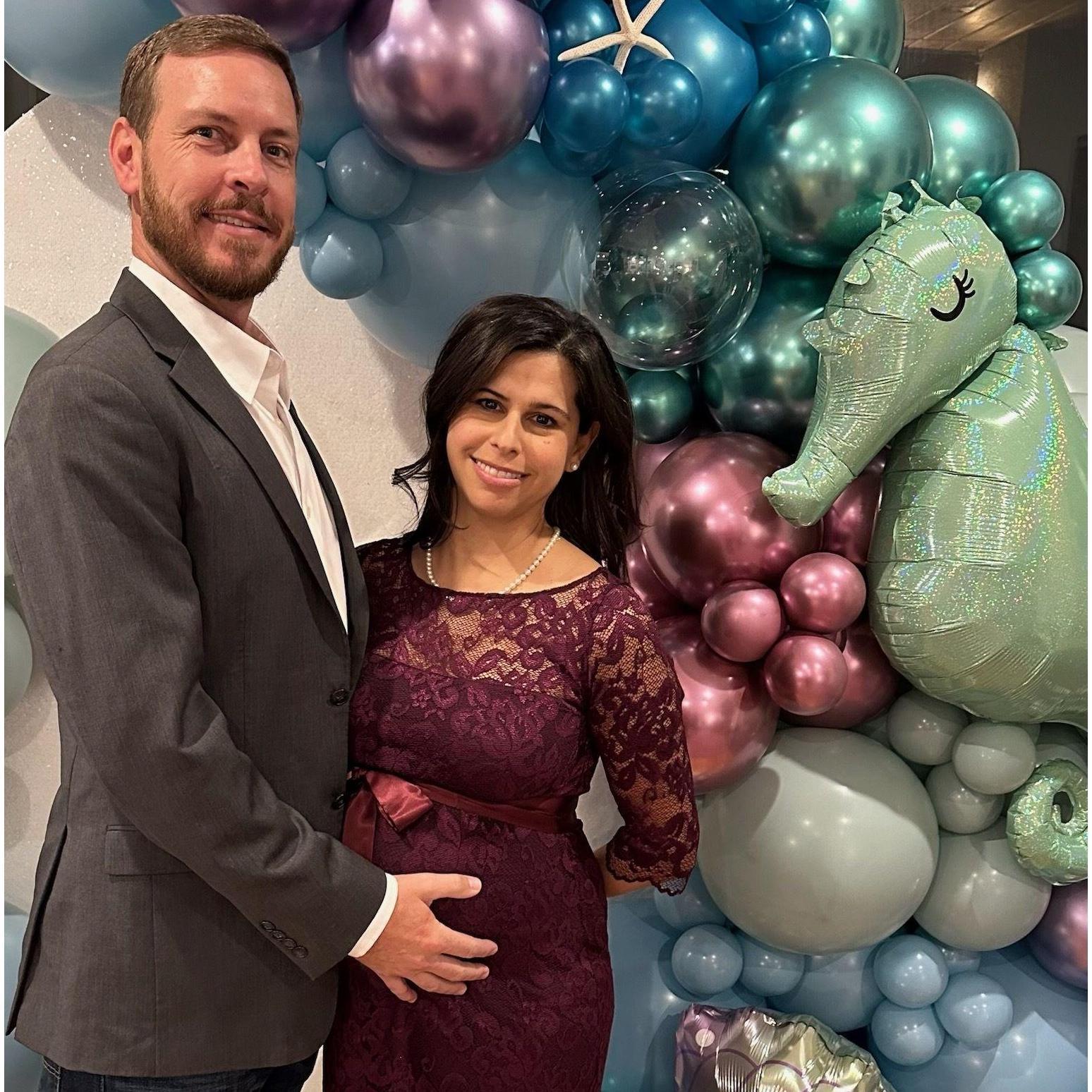 A baby shower turns engagement party, Adrienne is hiding her hand so she can make a big announcement at the shower her lovely bridesmaids threw her.