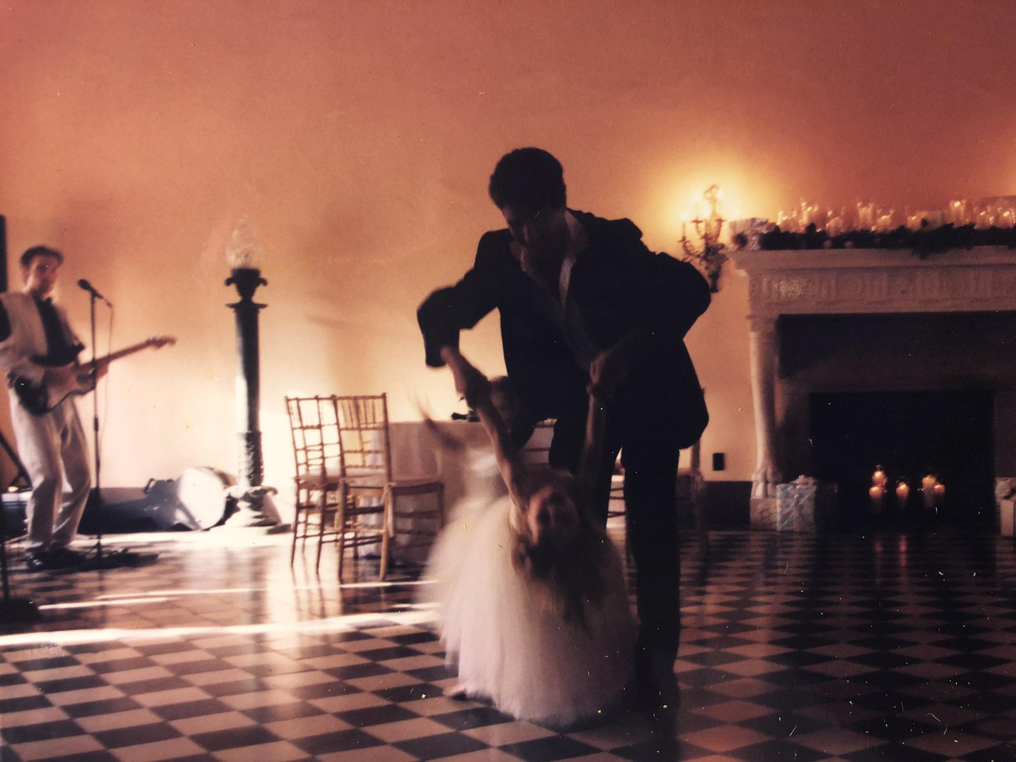 Lea and her dad in the middle of the dance floor