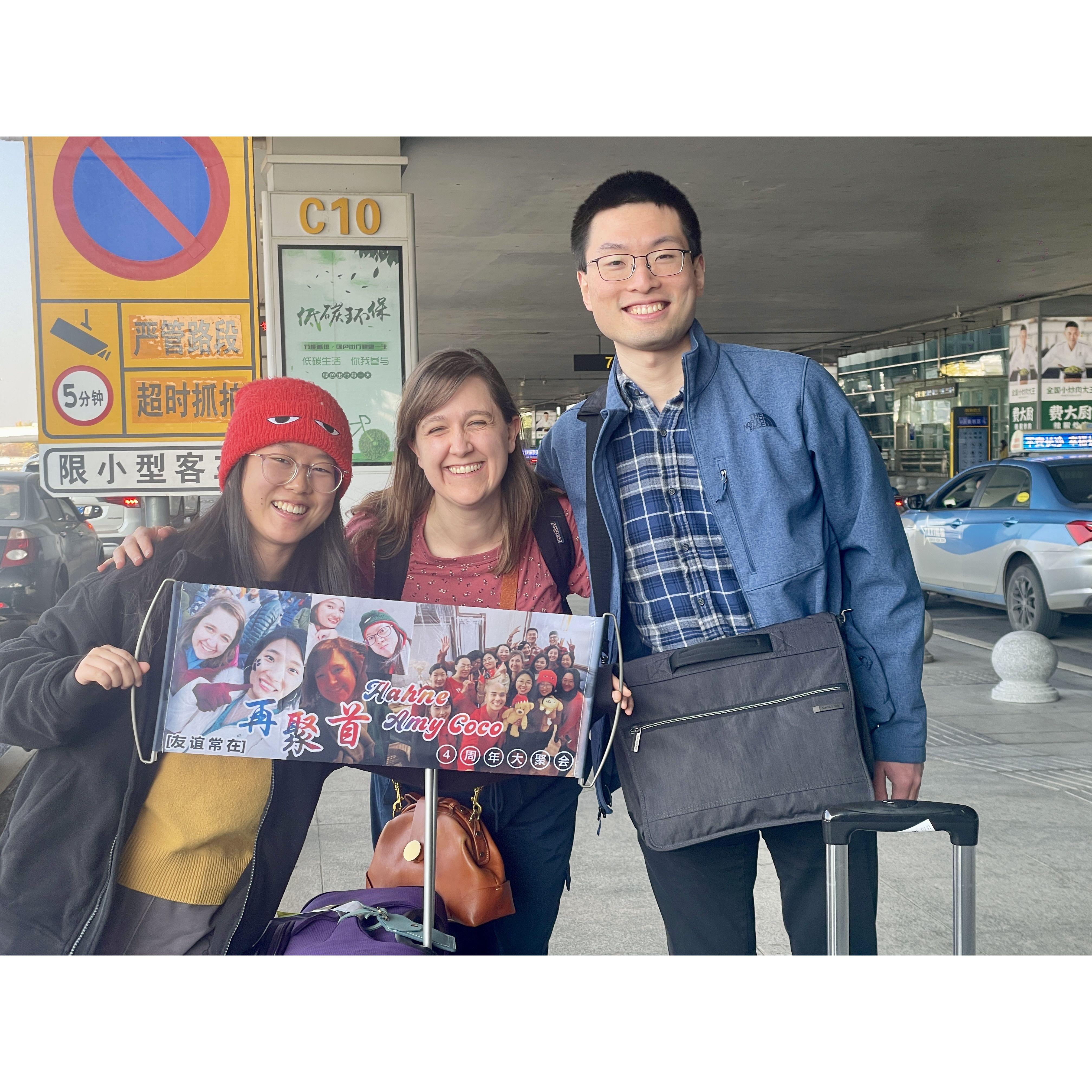 Greeted by friends at the airport