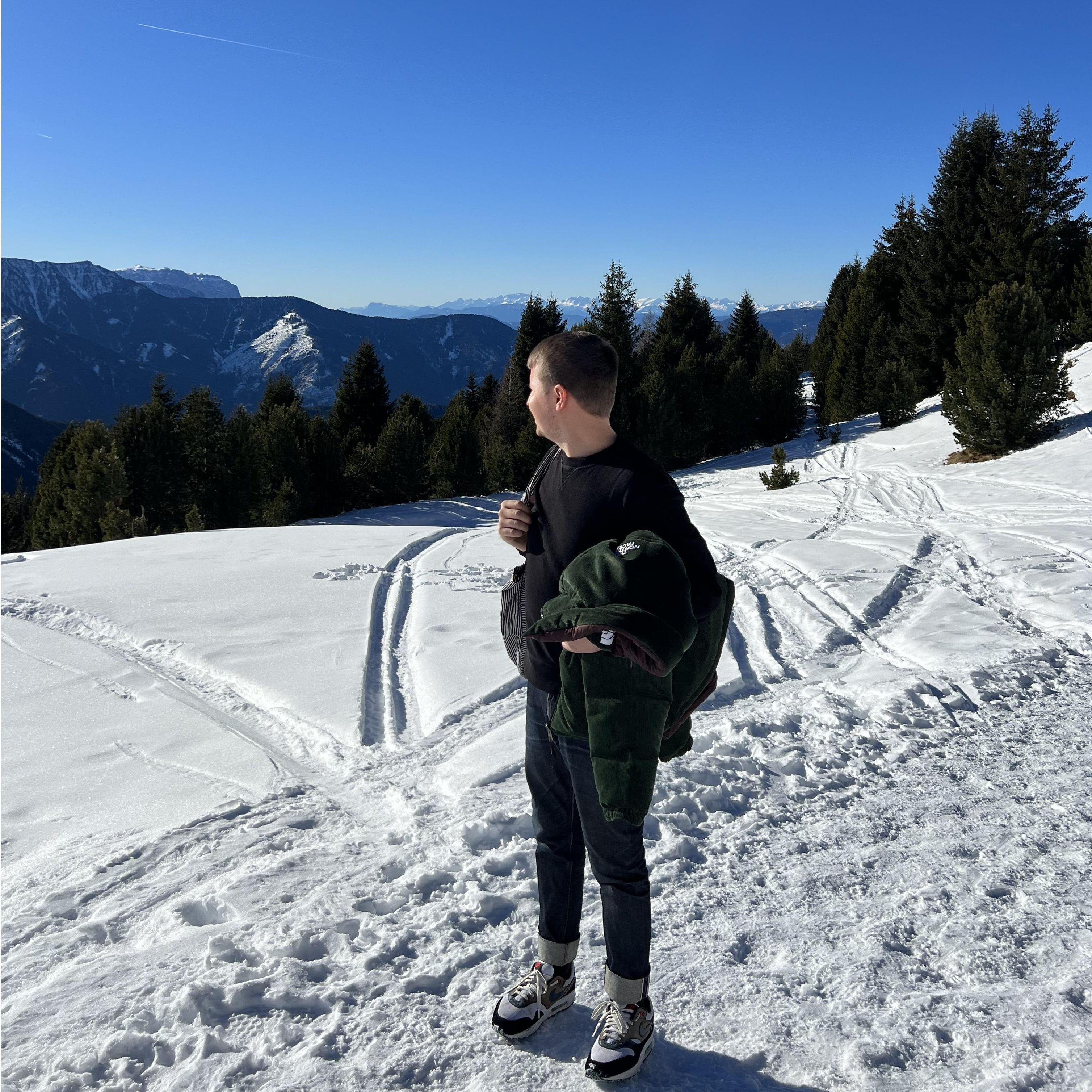 Dennis scouting for the perfect spot, while hanging onto his jacket for his dear life. Precious cargo in there.