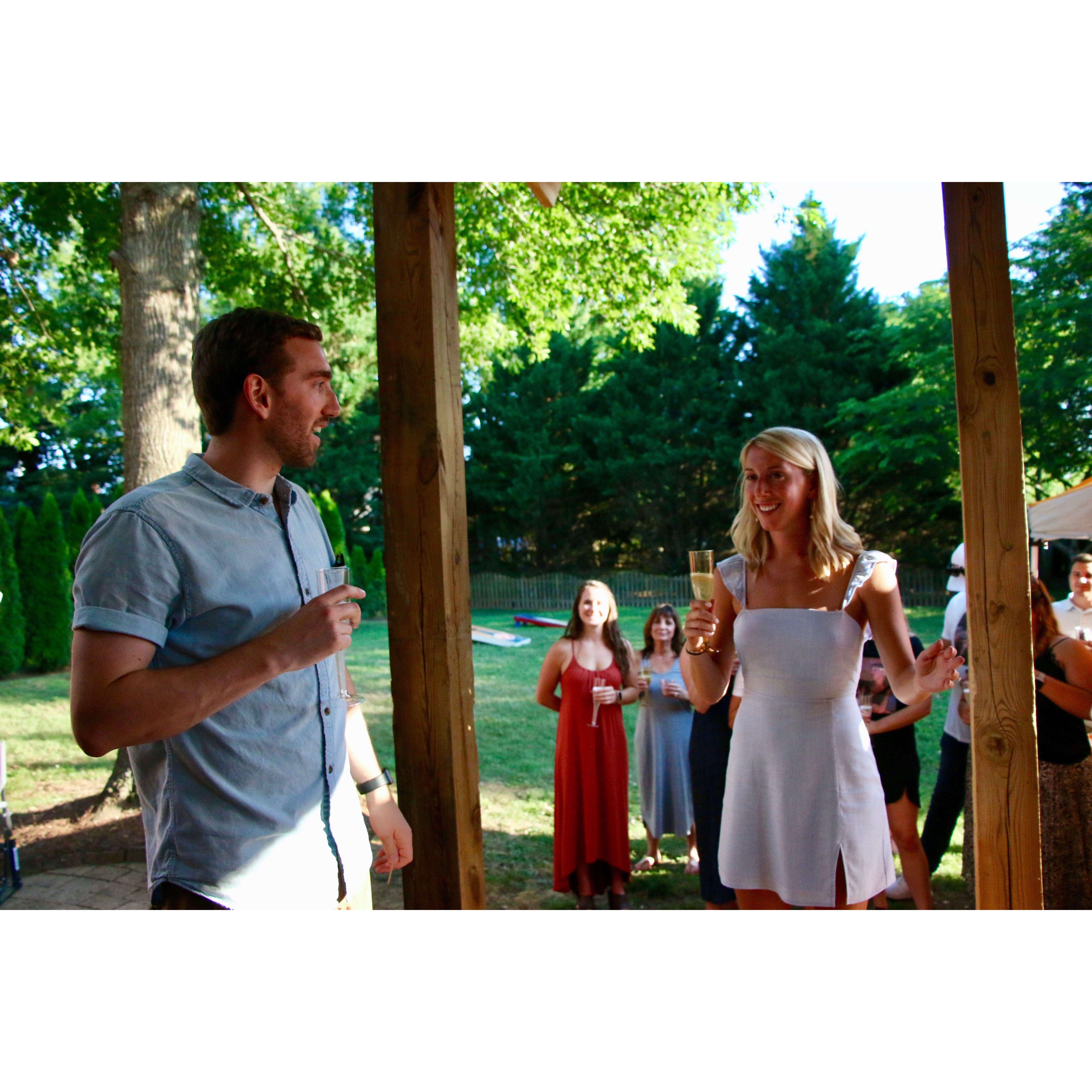 Our first picture! Hunter gave a speech at McKenzie's engagement party and there I am right in the middle. 6/20/20