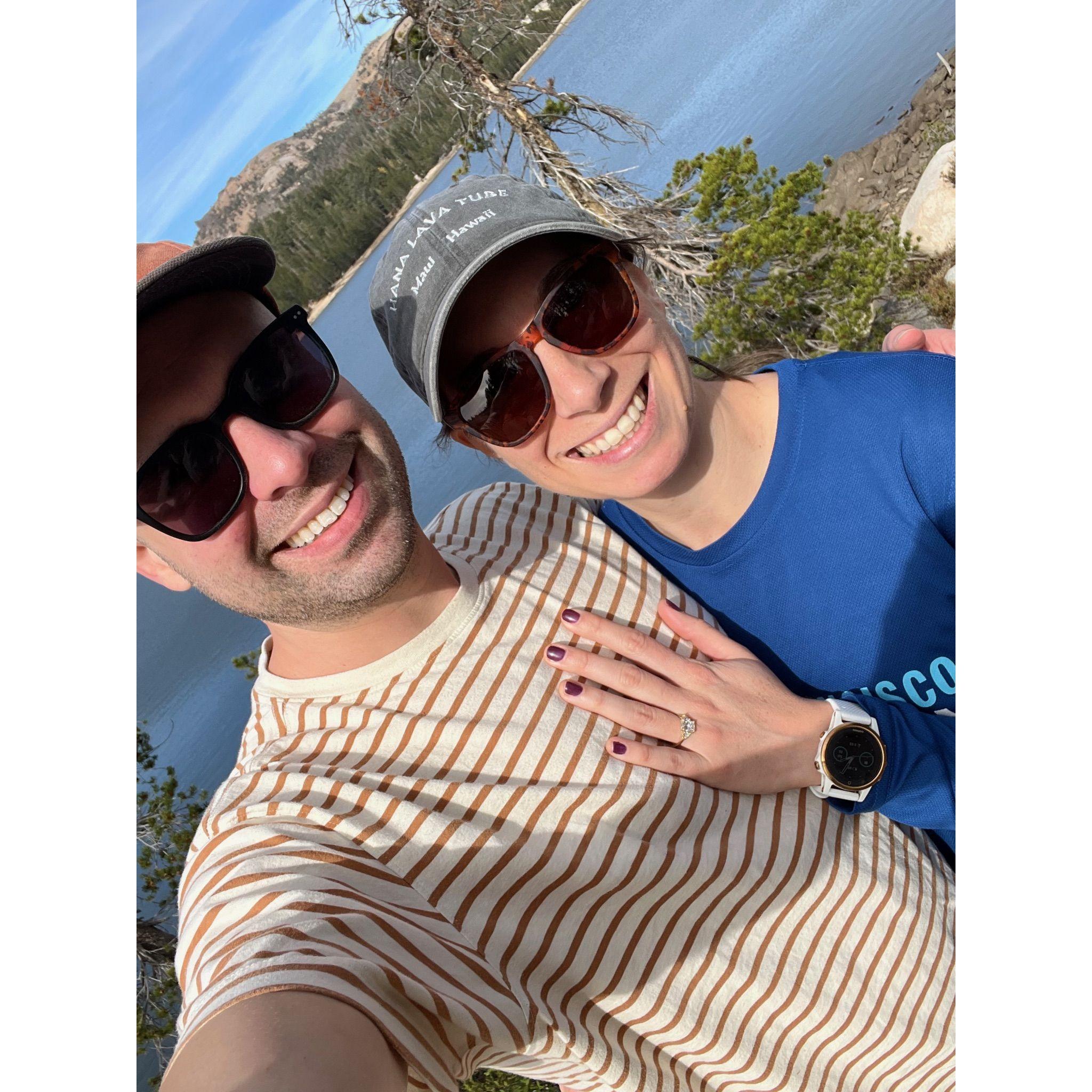 The newly engaged couple overlooking Lake Alpine