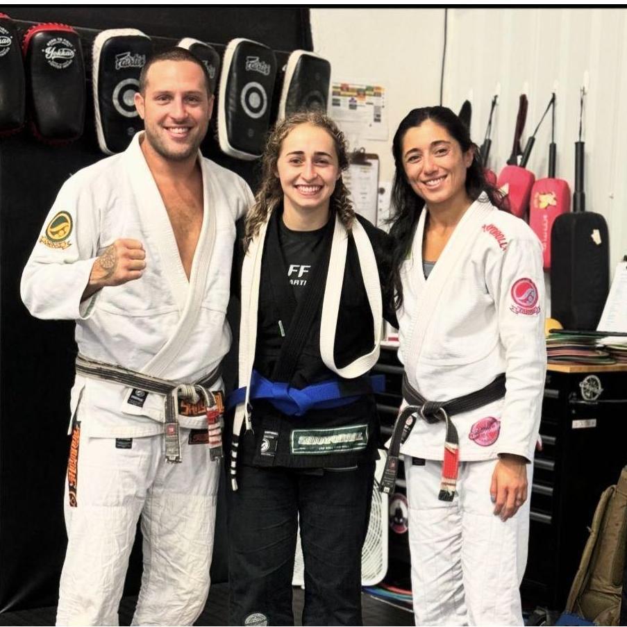Liam and Melissa Kerrigan with Coleen getting her blue belt in Brazilian Jiu Jitsu, 2024.